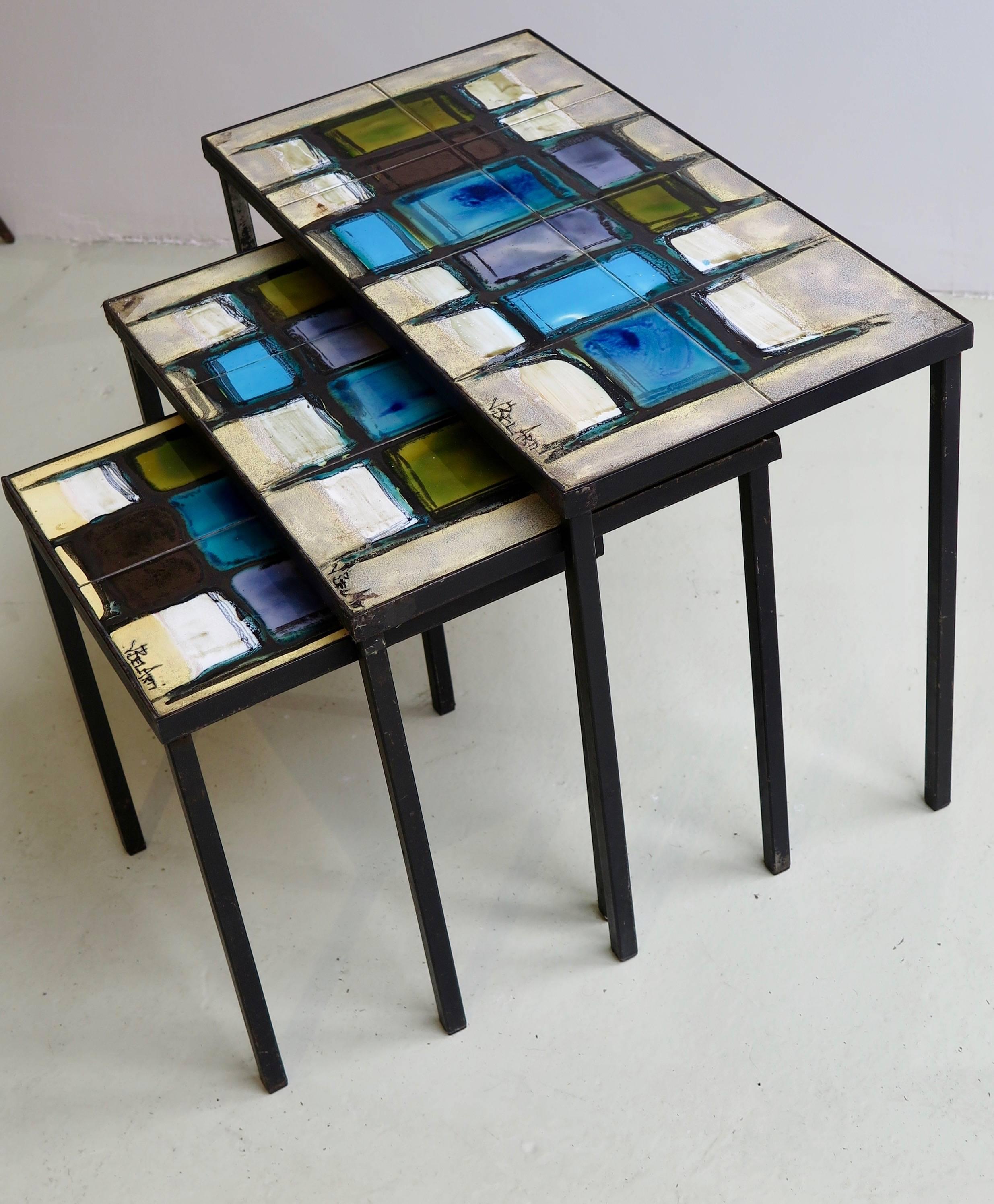 Nest of three tables with hand-painted ceramic tiles on black metal base frame by Belarti, Belgium, circa 1960. Signed.