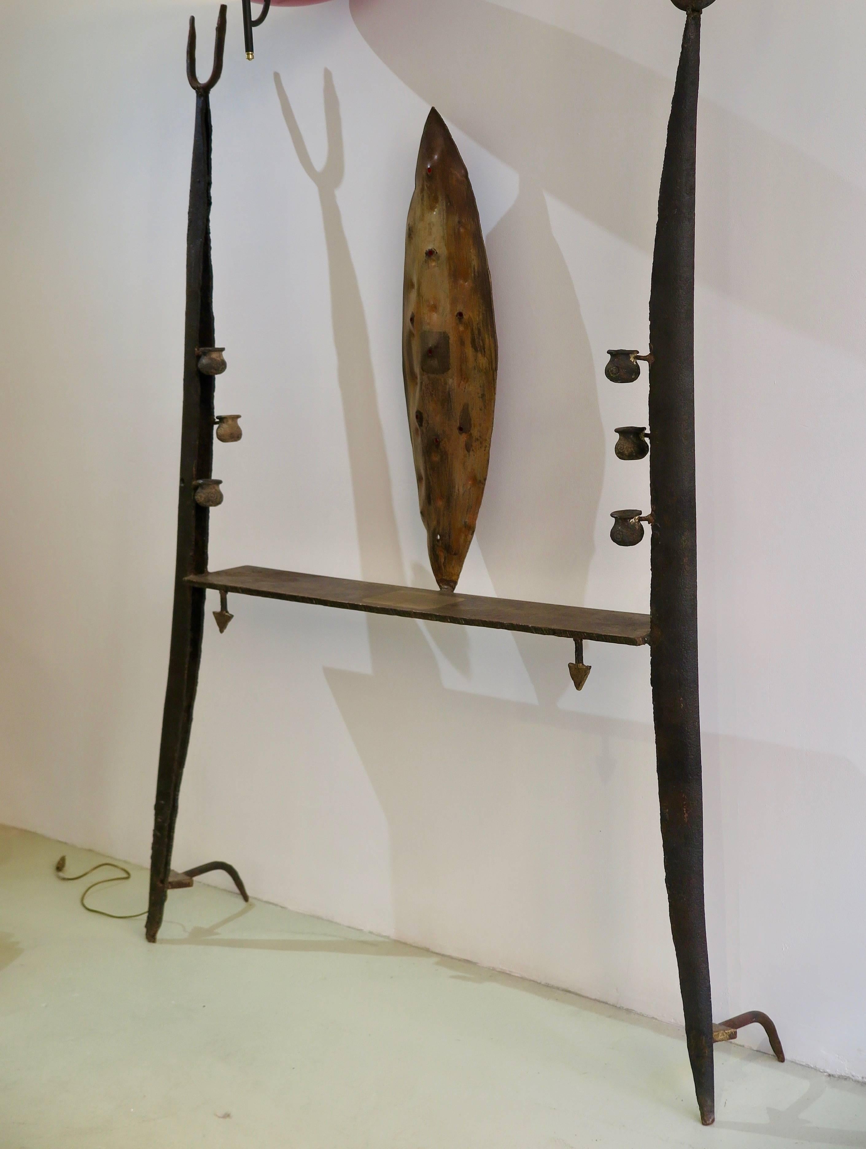 Unique large wall console or sculpture in bronze and iron by Jean-Jacques Argueyrolles, (1954) France, 1996.The console is inspired by African Art and is decorated with 24 - carat gold leaf.
Electrified with red lights.
Signed on the right leg: