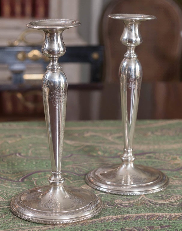 Exquisitely understated two Louis XIV engraved sterling silver candlesticks by Towle (U.S.) patented December 23, 1919 #37161. Filled base.