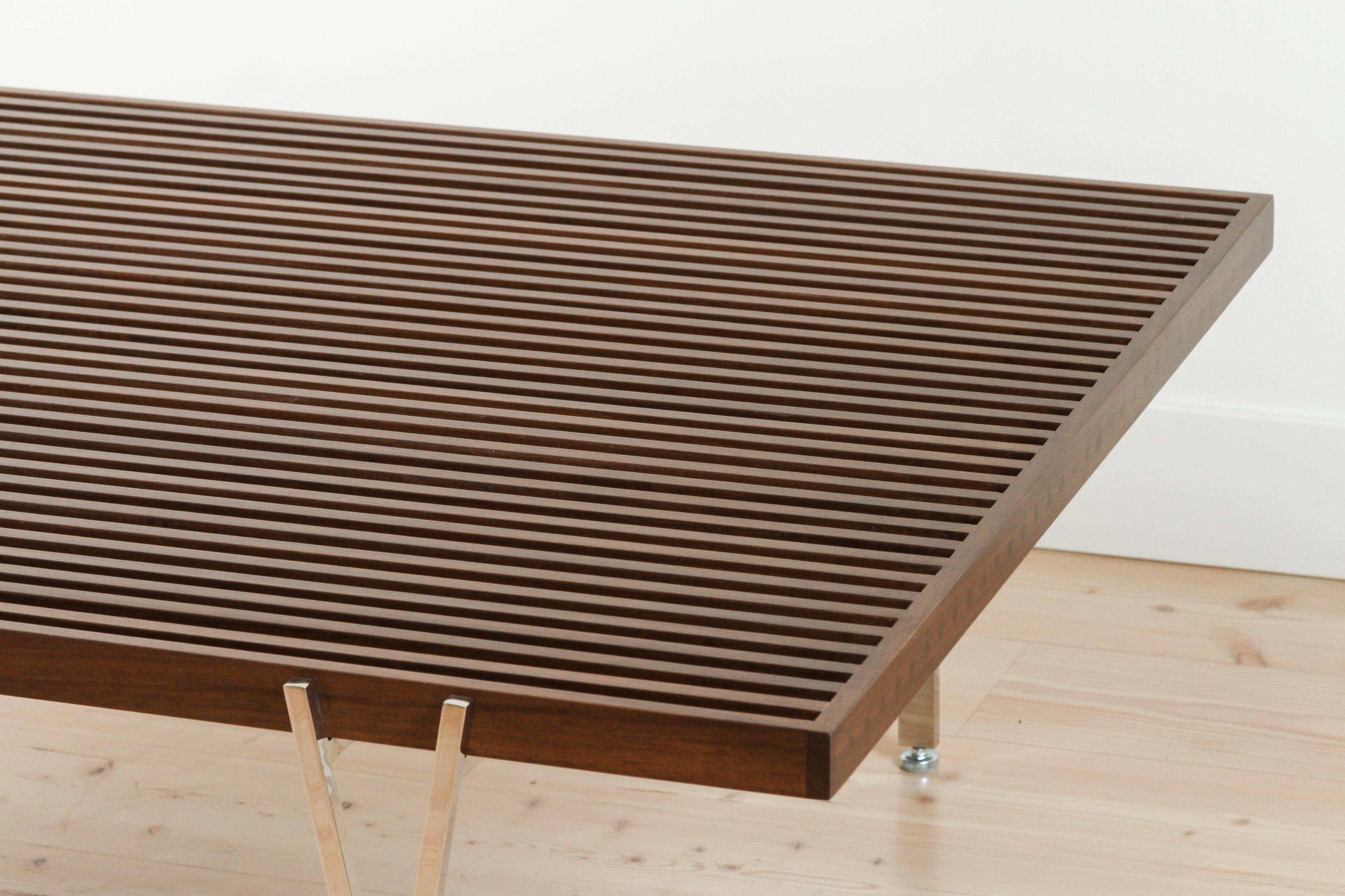 The Y-Leg Coffee Table top is composed of solid American walnut or white oak strips. Both ends of the table have visible dowel joinery which adds to the handcrafted feel and the strength of the table. The plated steel base comes with adjustable