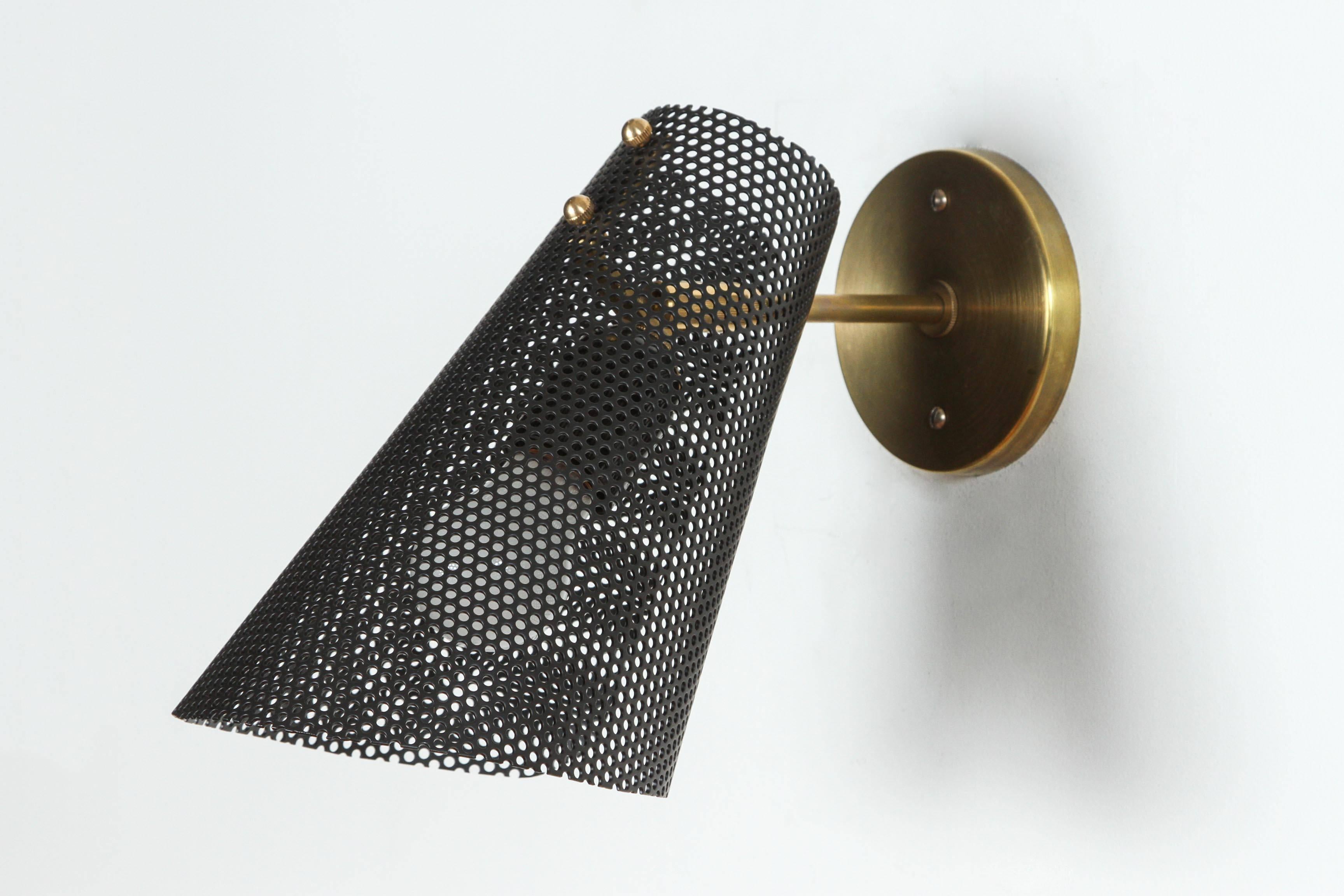 Perferated scoop sconce by Lawson-Fenning.
