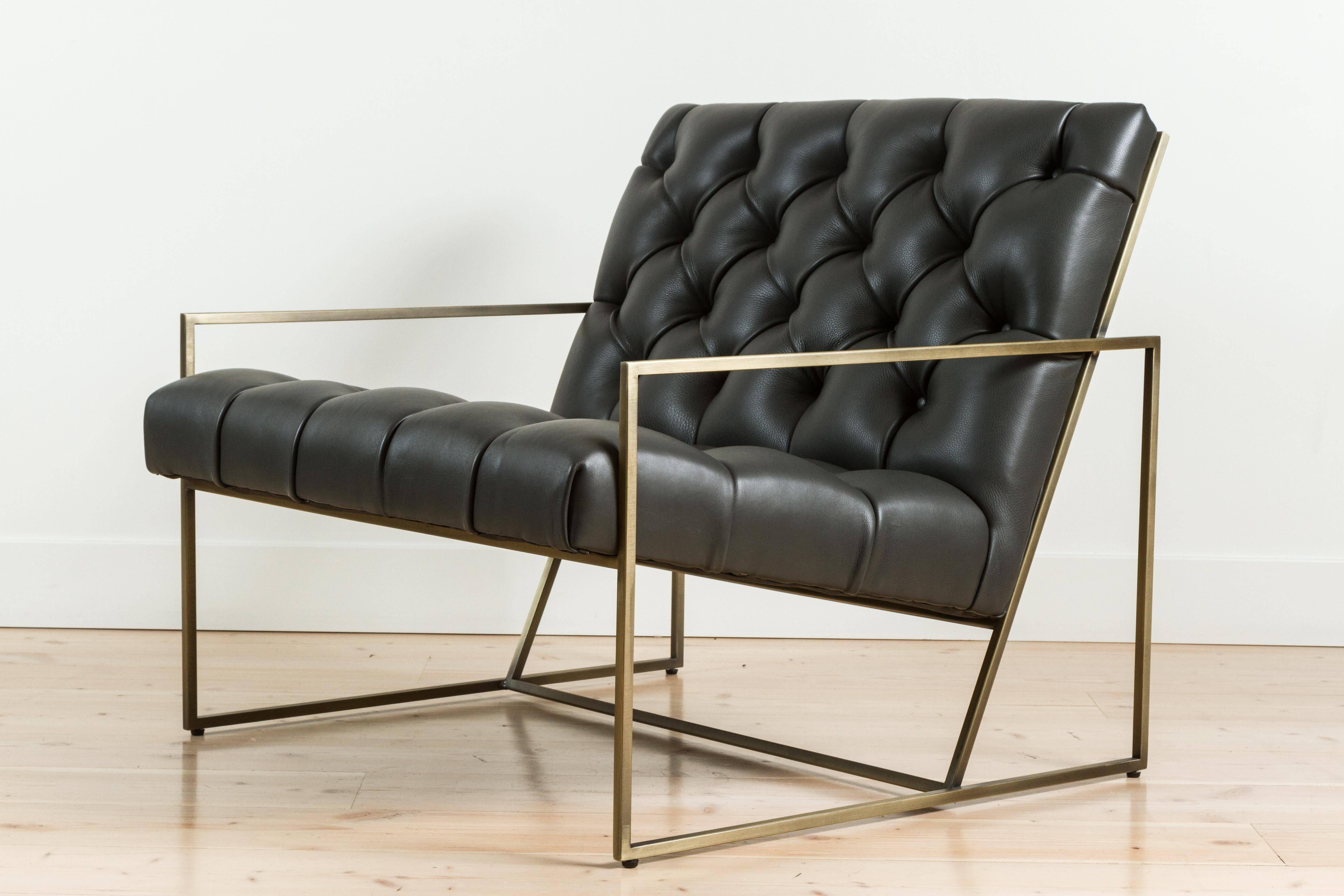 Thin frame lounge chair in diamond tufted charcoal leather by Lawson-Fenning with antiqued brass frame.

Also available to order in customer's own materials with a 8-10 week lead time. 

As show: $2,656
To order: $ 1900 + COM