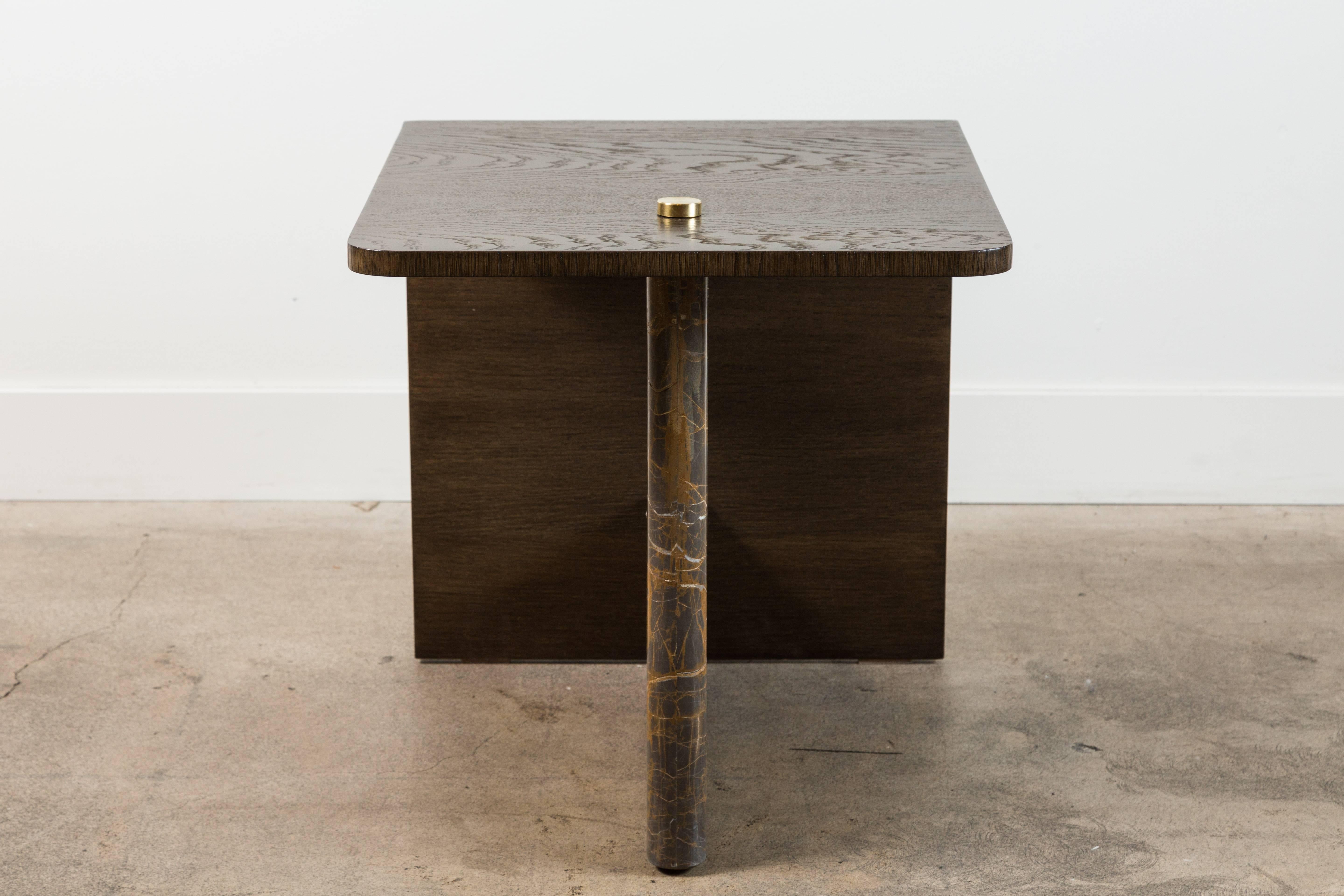 The Huxley Side Table features a waterfall oak or walnut top, a stepped stone base and brass details.

Available to order in various finishes with a 10-12 week lead time.