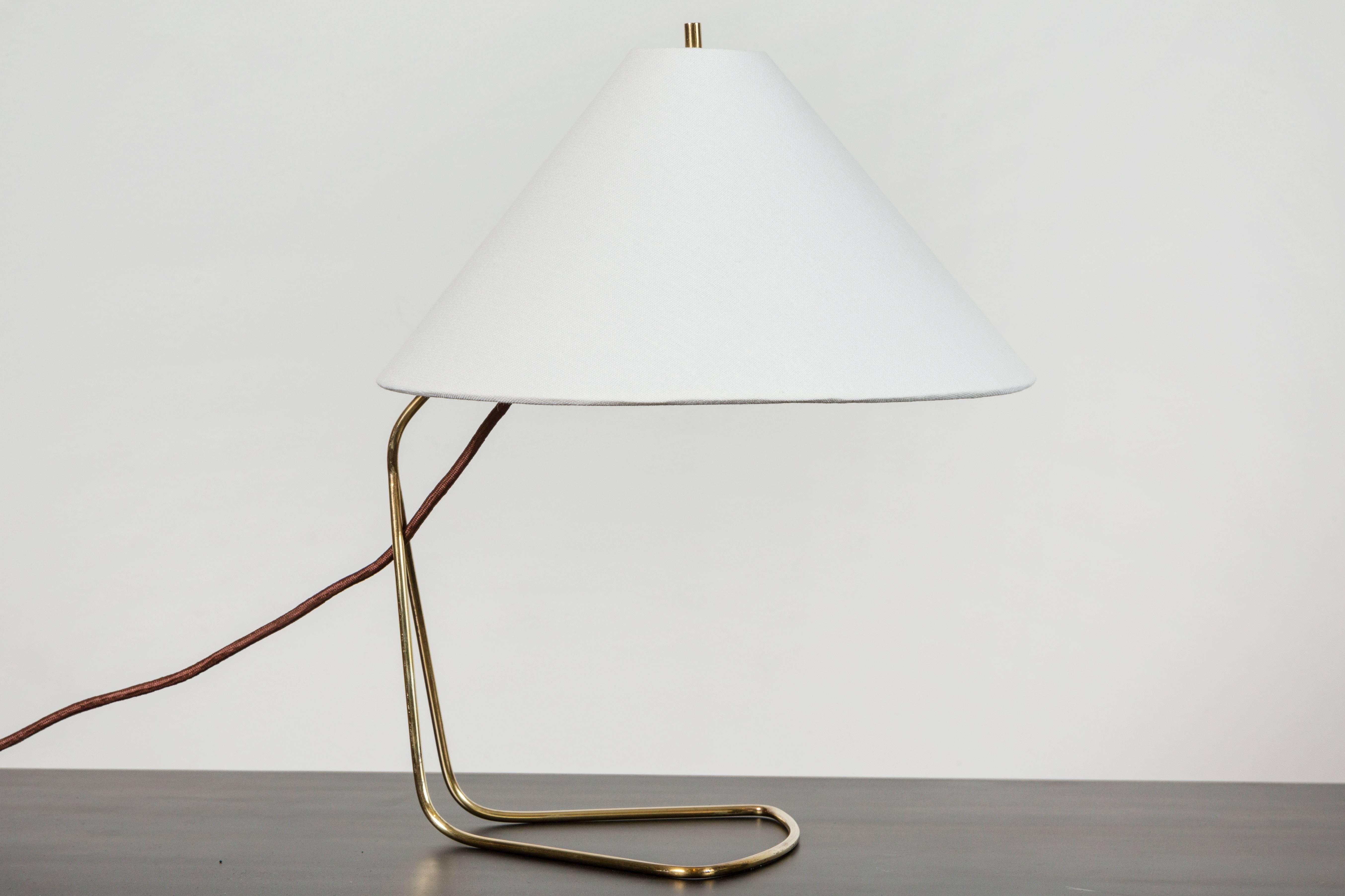 Pair of Austrian brass table lamps by J.T Kalamar. Shade pivots on a hinge to make them wall-mounted.
