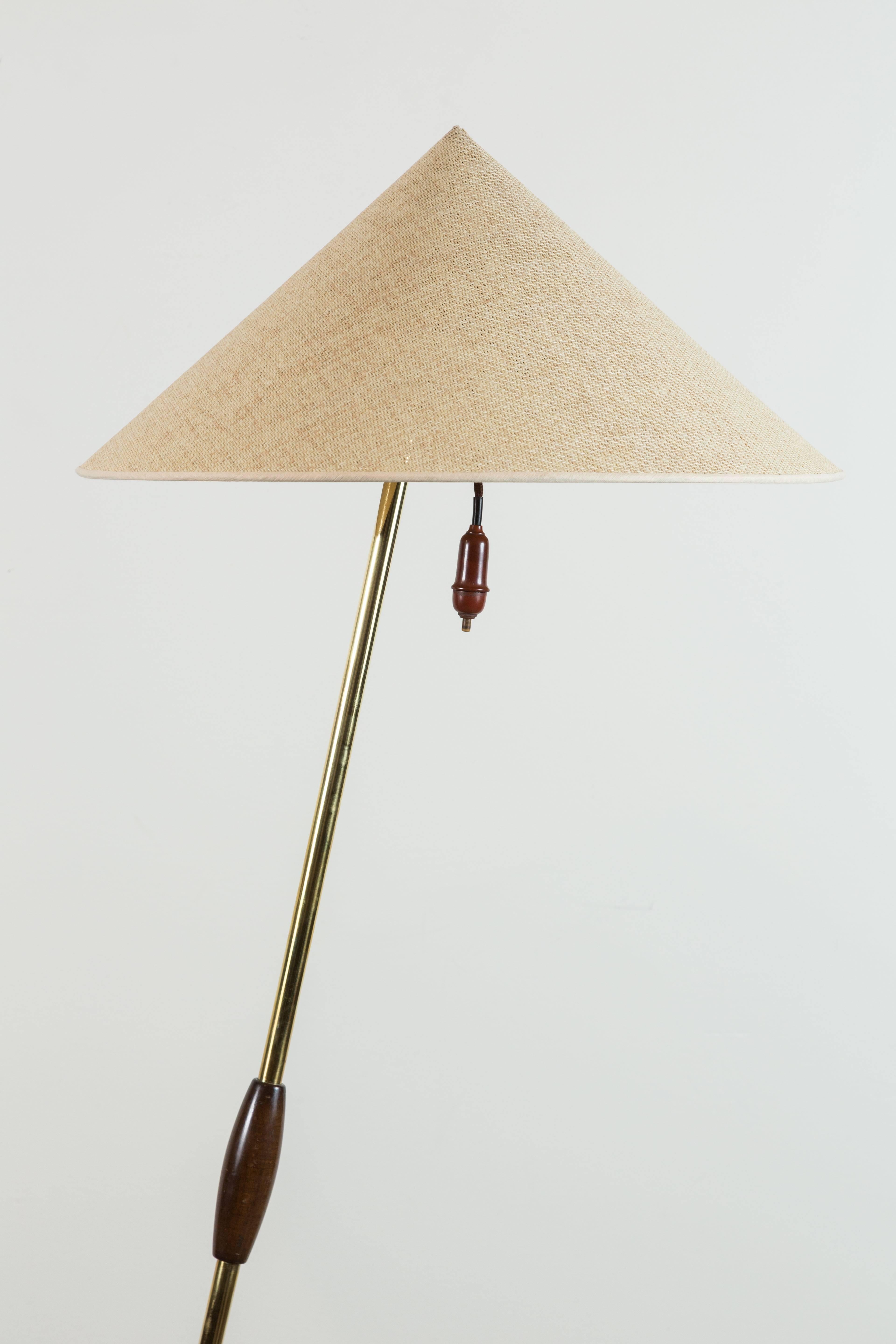 Brass floor lamp by Rupert Nikoll.