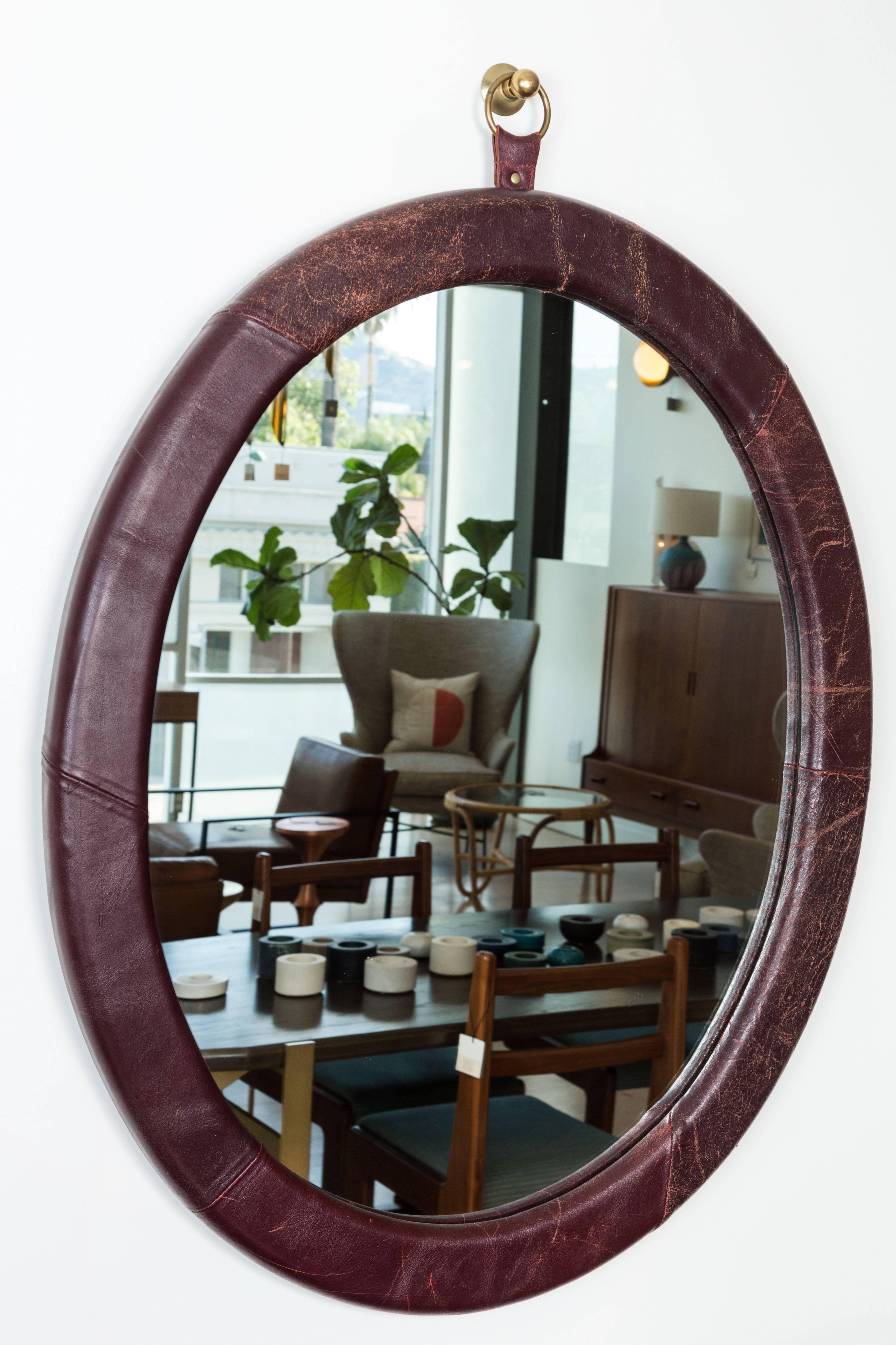 Leather oval mirror by Jason Koharik for Collected By.