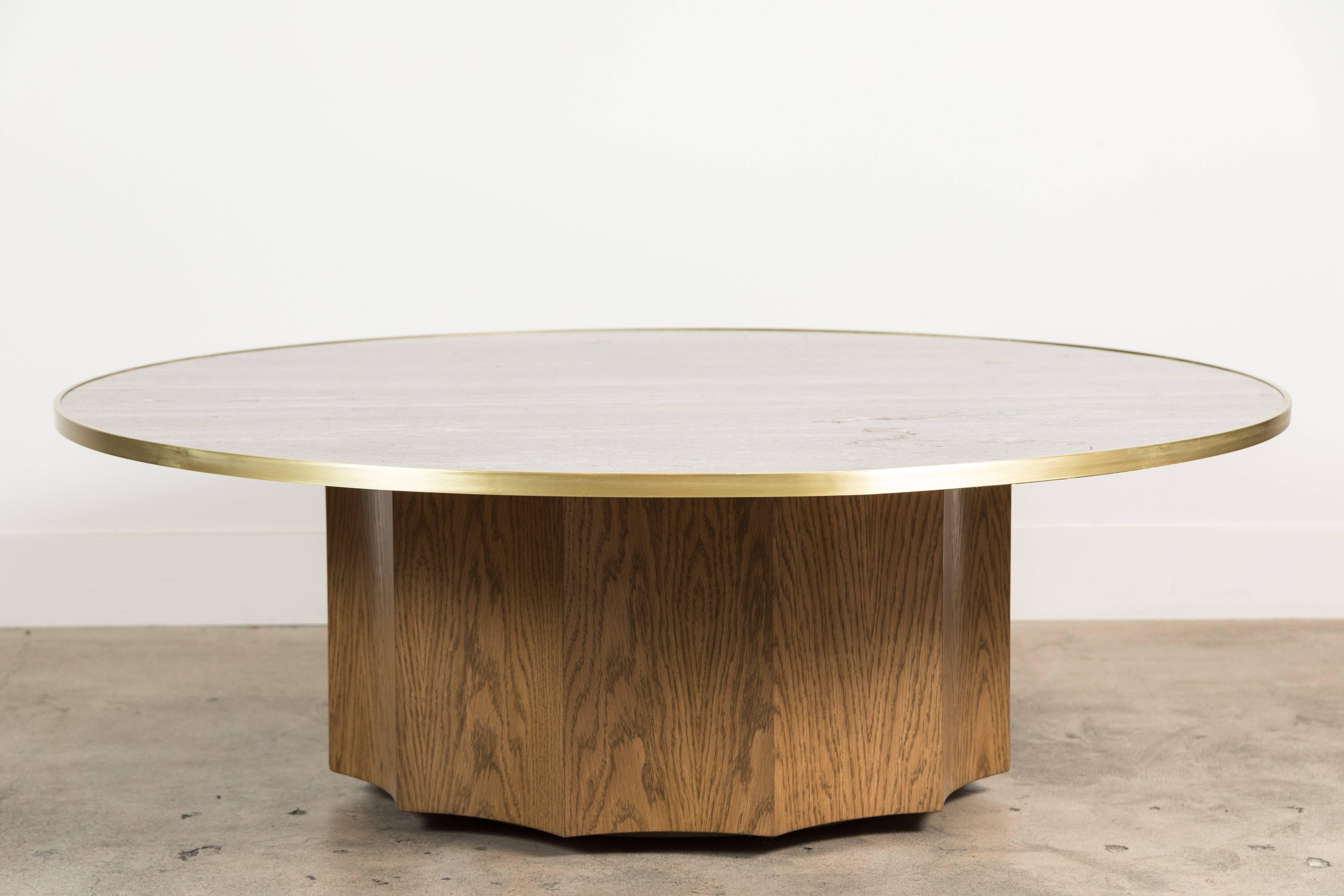 The Normandie Cocktail Table features a fluted white oak or American walnut base with a brass-trimmed stone top. Available in three sizes. Shown here in Titanium Travertine and Smoked Oak. 

Variations:
36