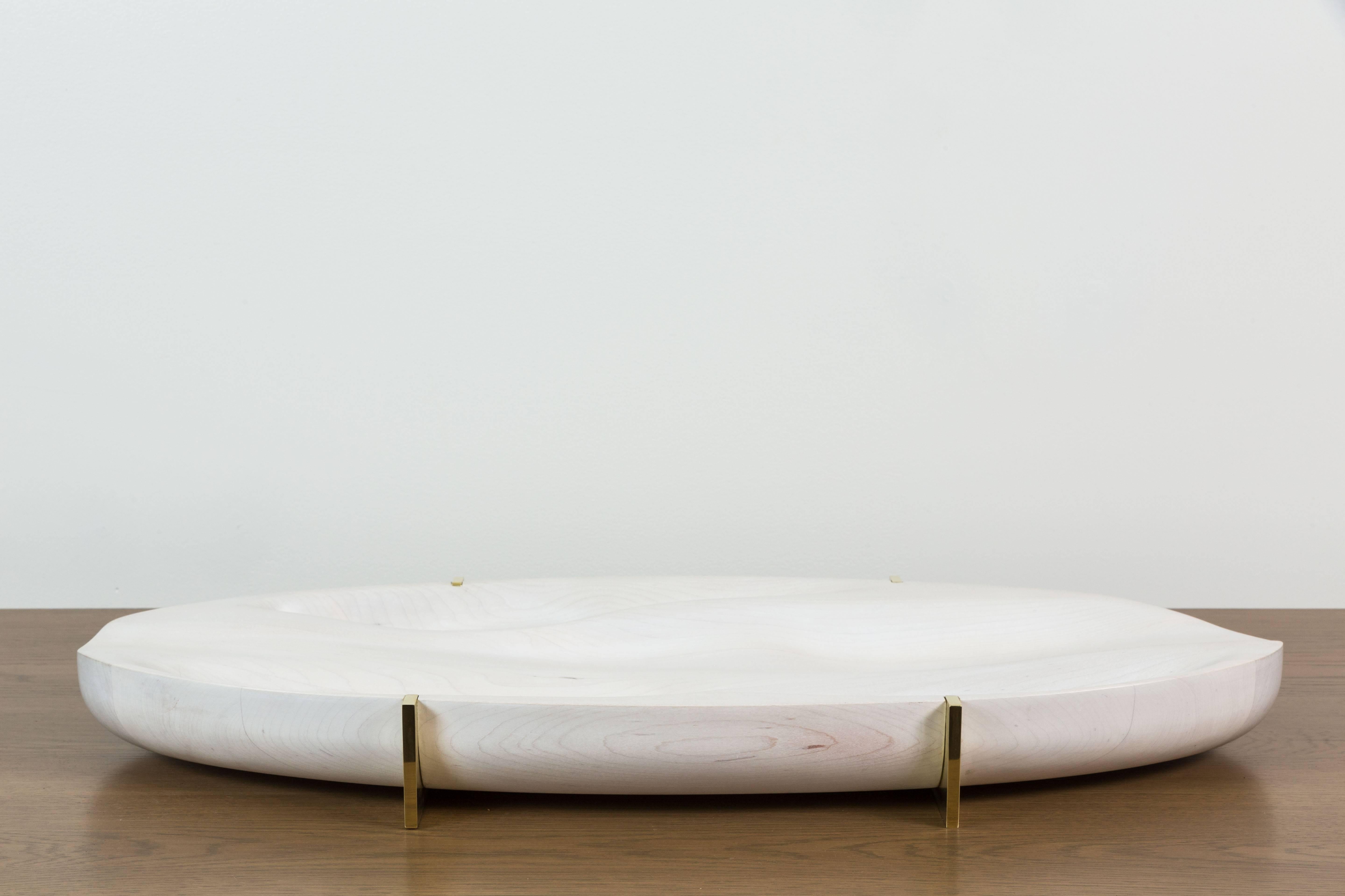 Bleached Maple and Brass Oval Tray by artist Vincent Pocsik in collaboration with Lawson-Fenning. Features sculptural carved wood and a machined brass base. Made of natural materials, this decorative object can be accessorized on table top, book