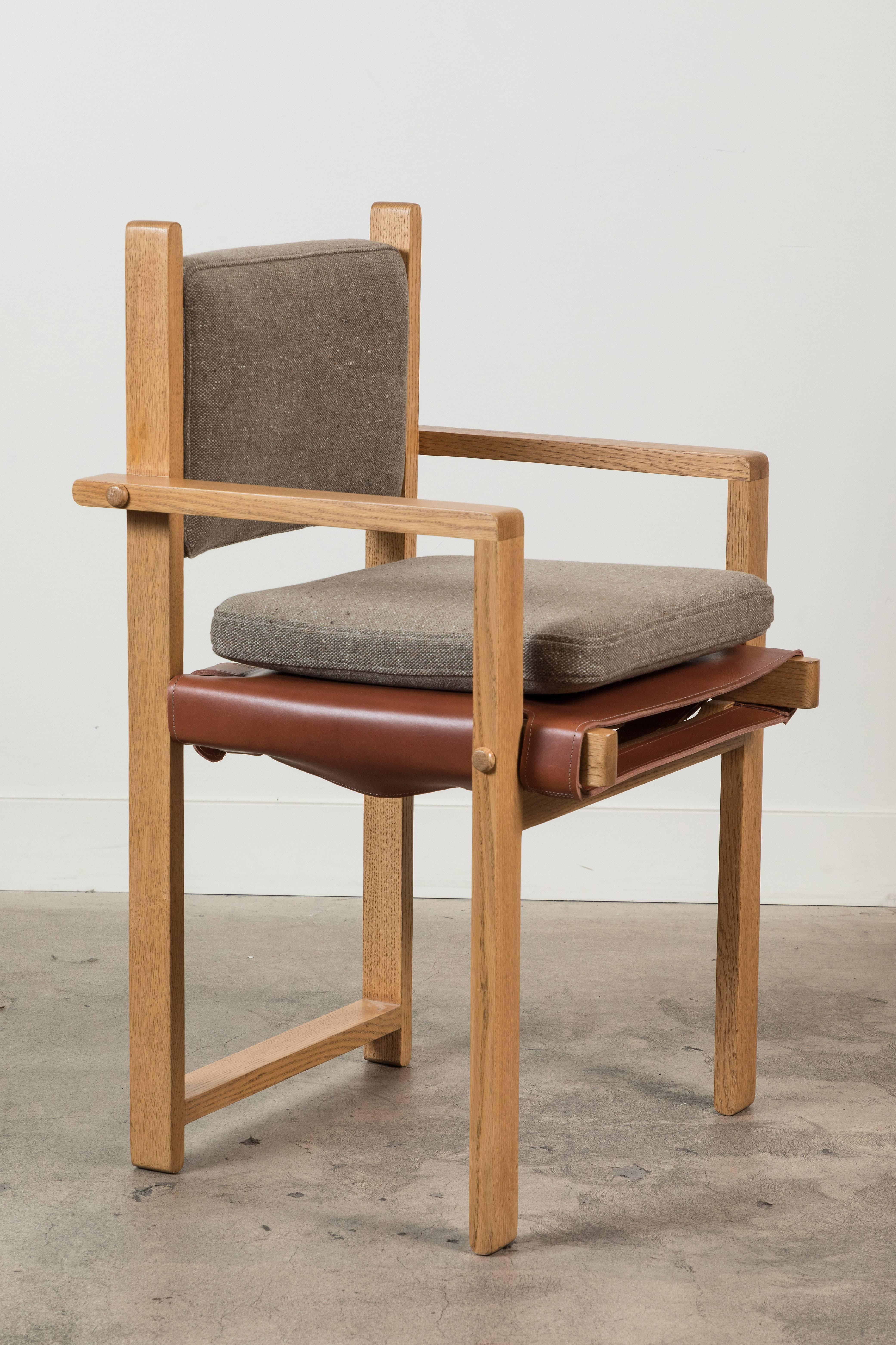 The Morro Dining Chair is made from a solid American walnut or white oak frame and features an upholstered back cushion and a leather sling seat. An optional loose seat cushion is also available.

Available to order in customer's own material with a