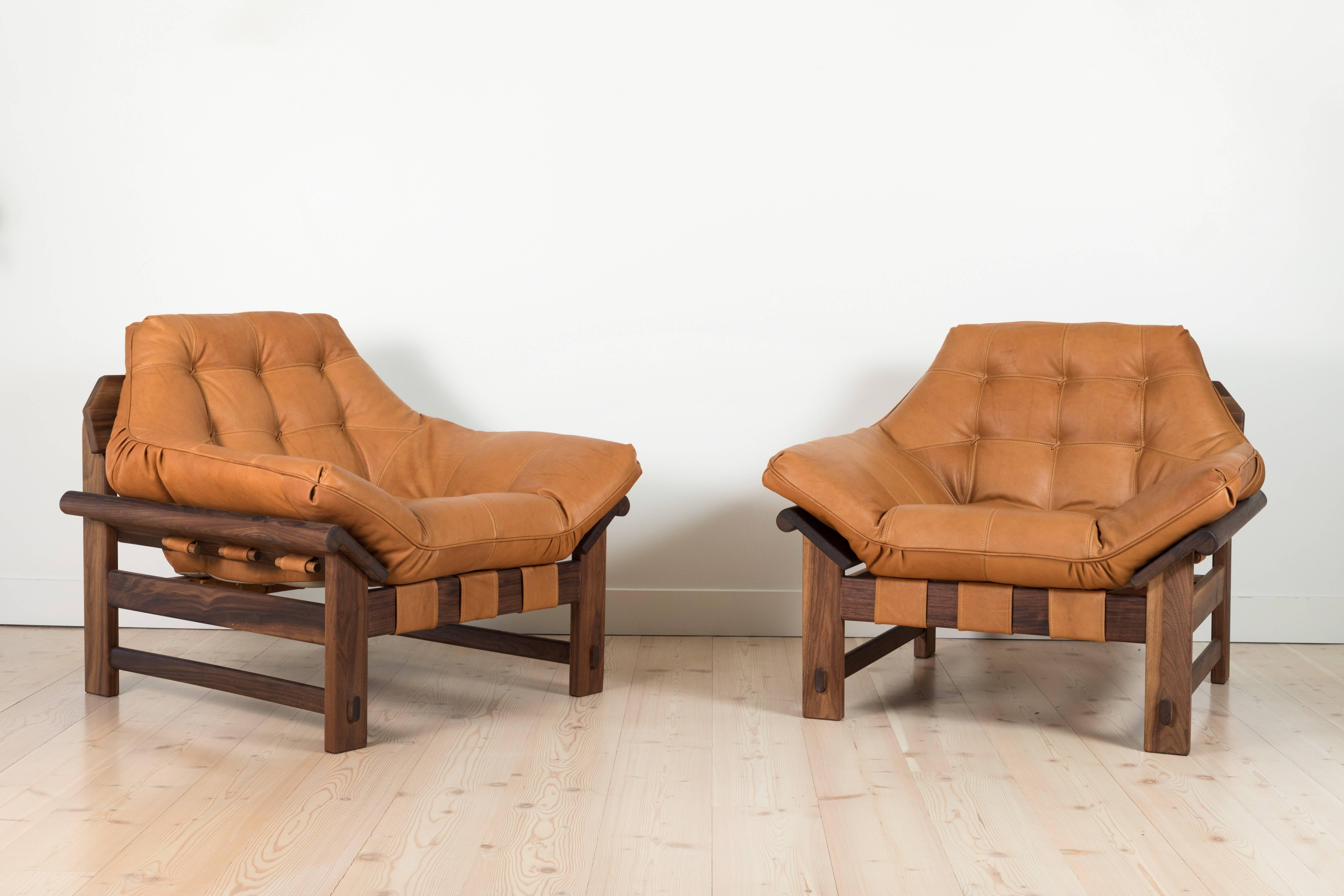 The Ojai Lounge Chair features a solid White Oak or solid Walnut base and a single tufted leather cushion with leather straps. Shown here in Tan Leather and Oiled Walnut. 

The Lawson-Fenning Collection is designed and handmade in Los Angeles,