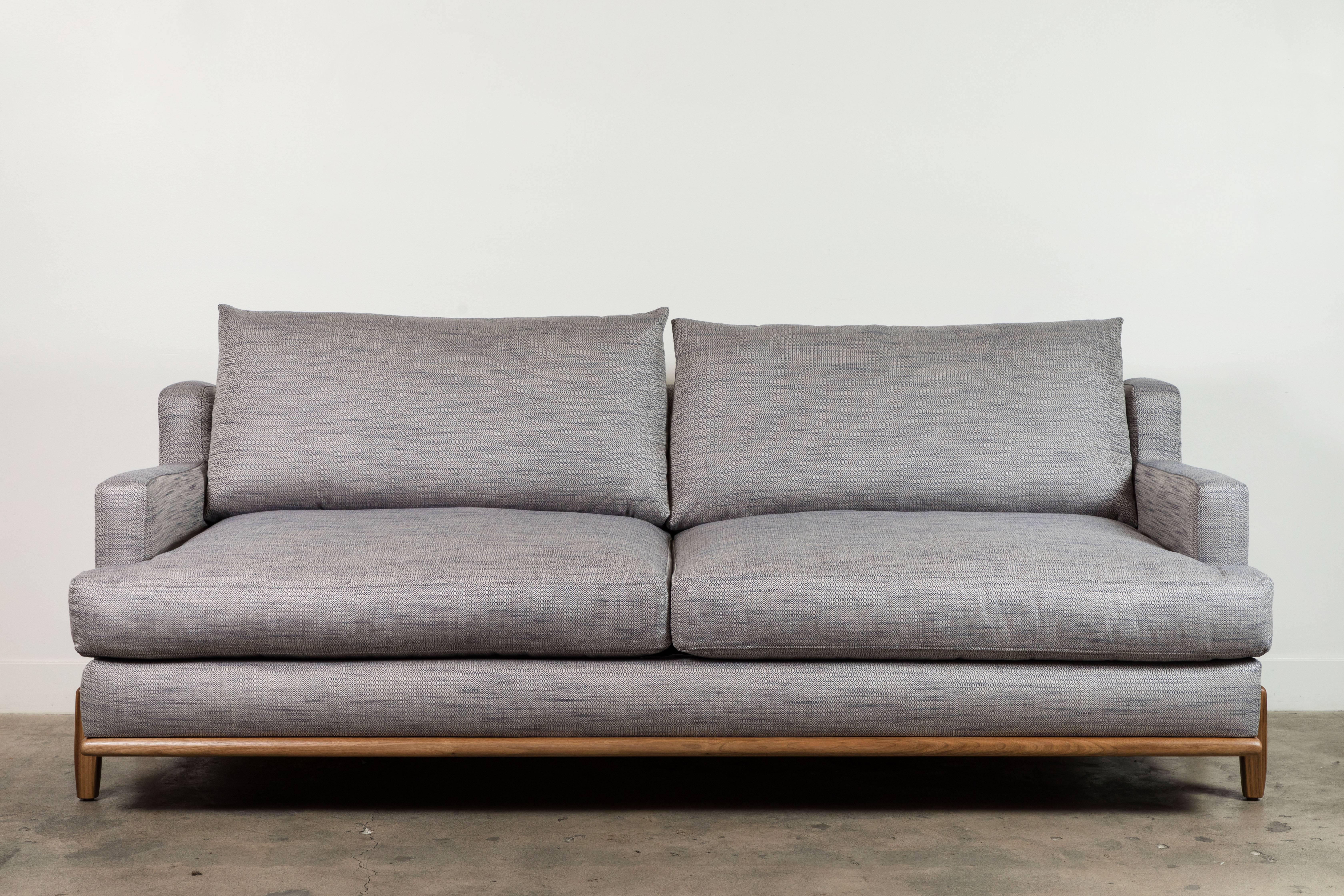 The George Sofa is part of the collaborative collection with interior designer Brian Paquette. The low profile silhouette sits above a sculpted solid wood base. This piece is available in exclusive BP for LF finishes as well as the standard