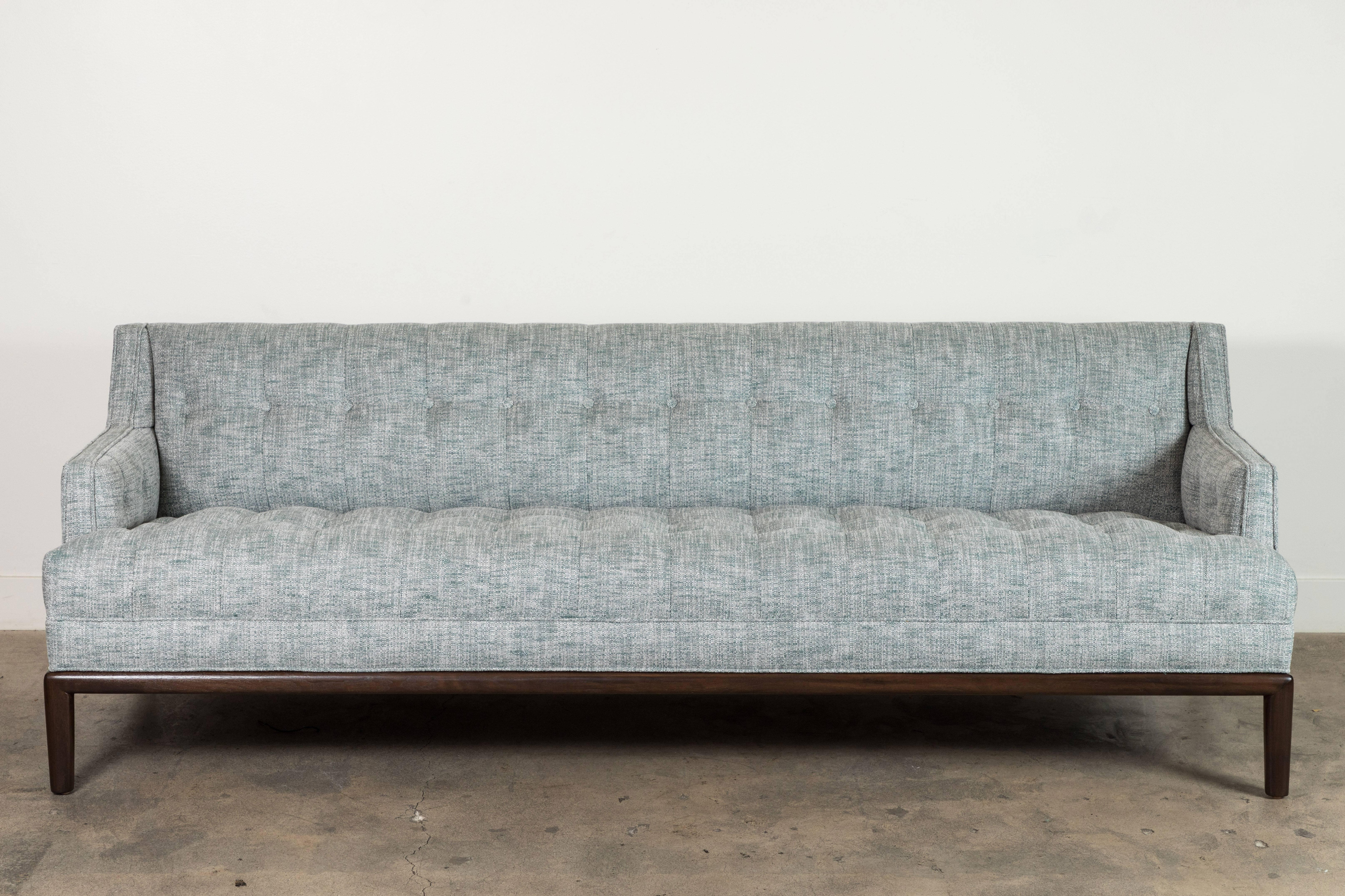 The Maurice Sofa is a midcentury inspired sofa with a tufted seat, back, and inner arms and piped details. The sofa rests atop a simple, rounded American walnut or white oak base.

Available to order in Customer's Own Material with a 6-8 week lead