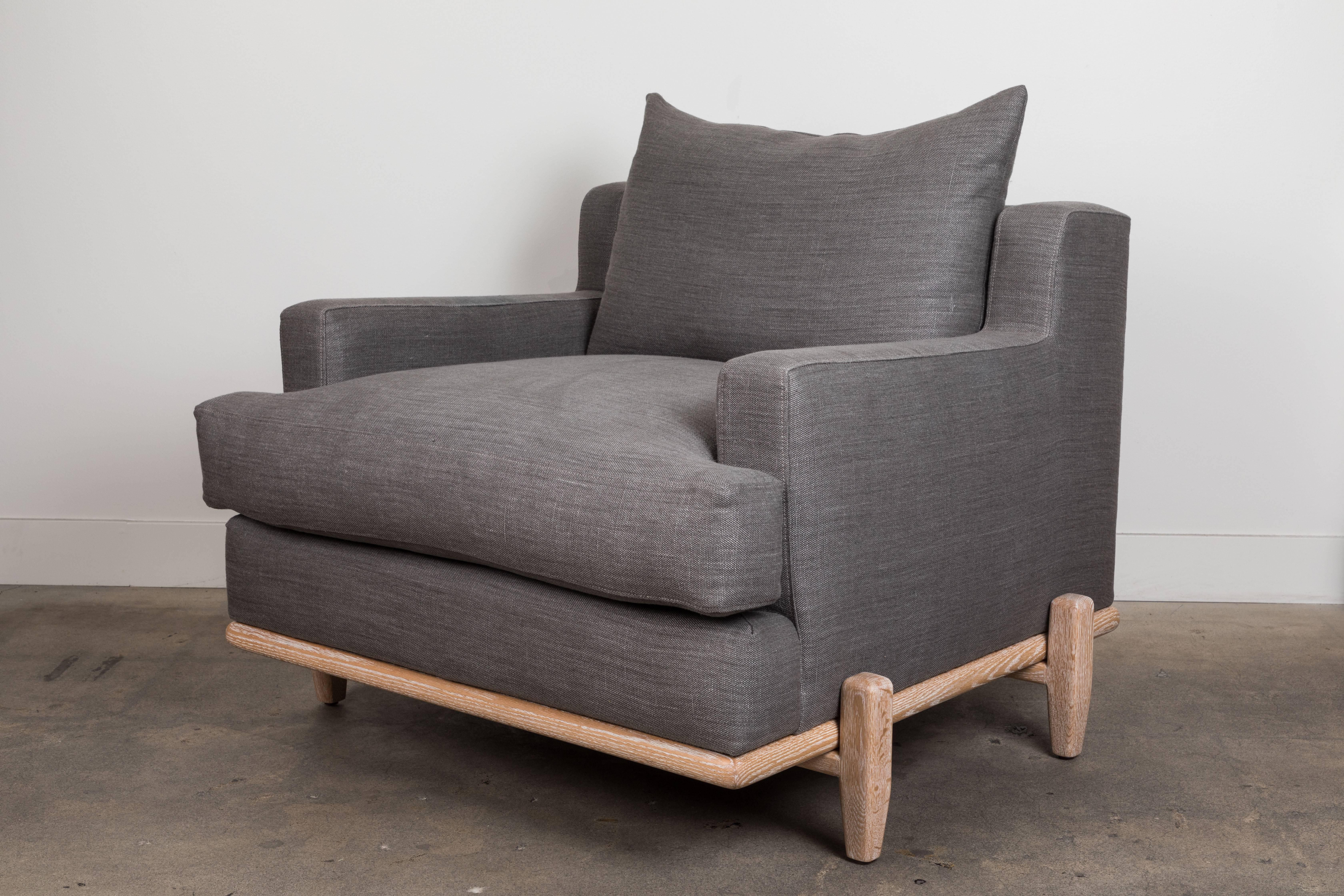The George Chair is part of the collaborative collection with interior designer Brian Paquette. The George Chair is a low profile, but wide-scale lounge chair that rests on top of a solid wood base. This piece is available in exclusive BP for LF