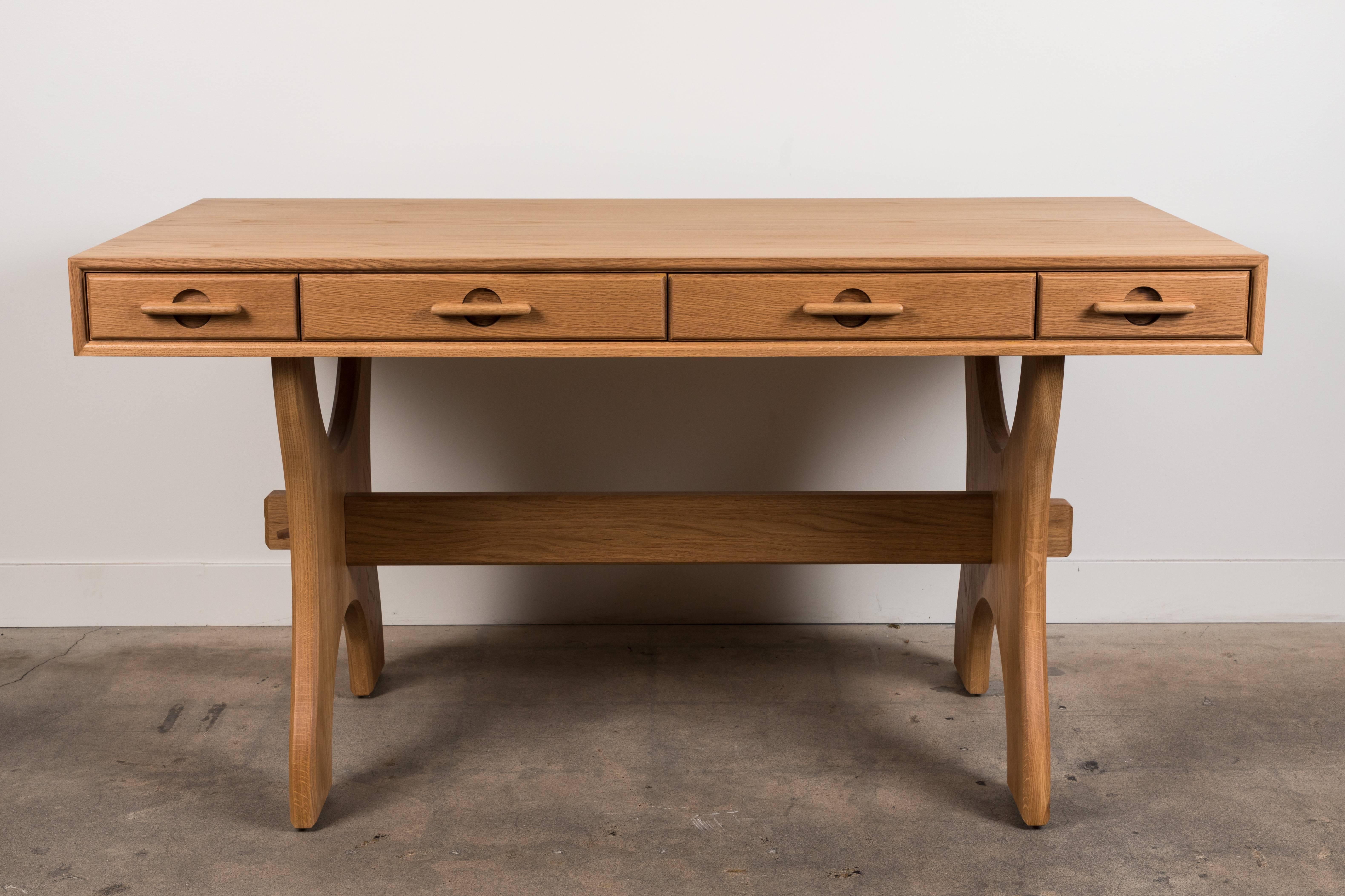 The Ojai desk has four drawers and features solid American walnut or white oak trestle legs. The drawer handles are made of solid carved wood. Shown here in Oiled Oak. Available finishes may vary. 

The Lawson-Fenning Collection is designed and