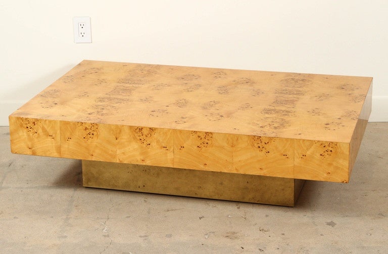 Olive burl coffee table with brass base by Milo Baughman.
