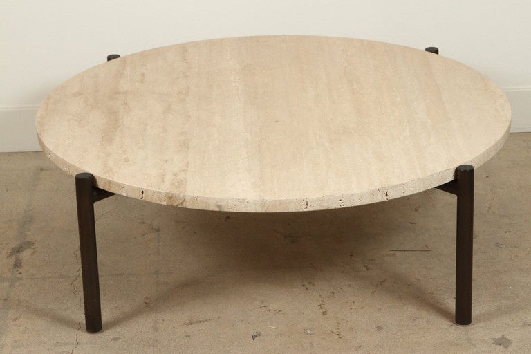 Tivoli indoor/outdoor coffee table by Ten10. 

Base is made of oil rubbed bronze and can also be ordered in a brass plate finish.