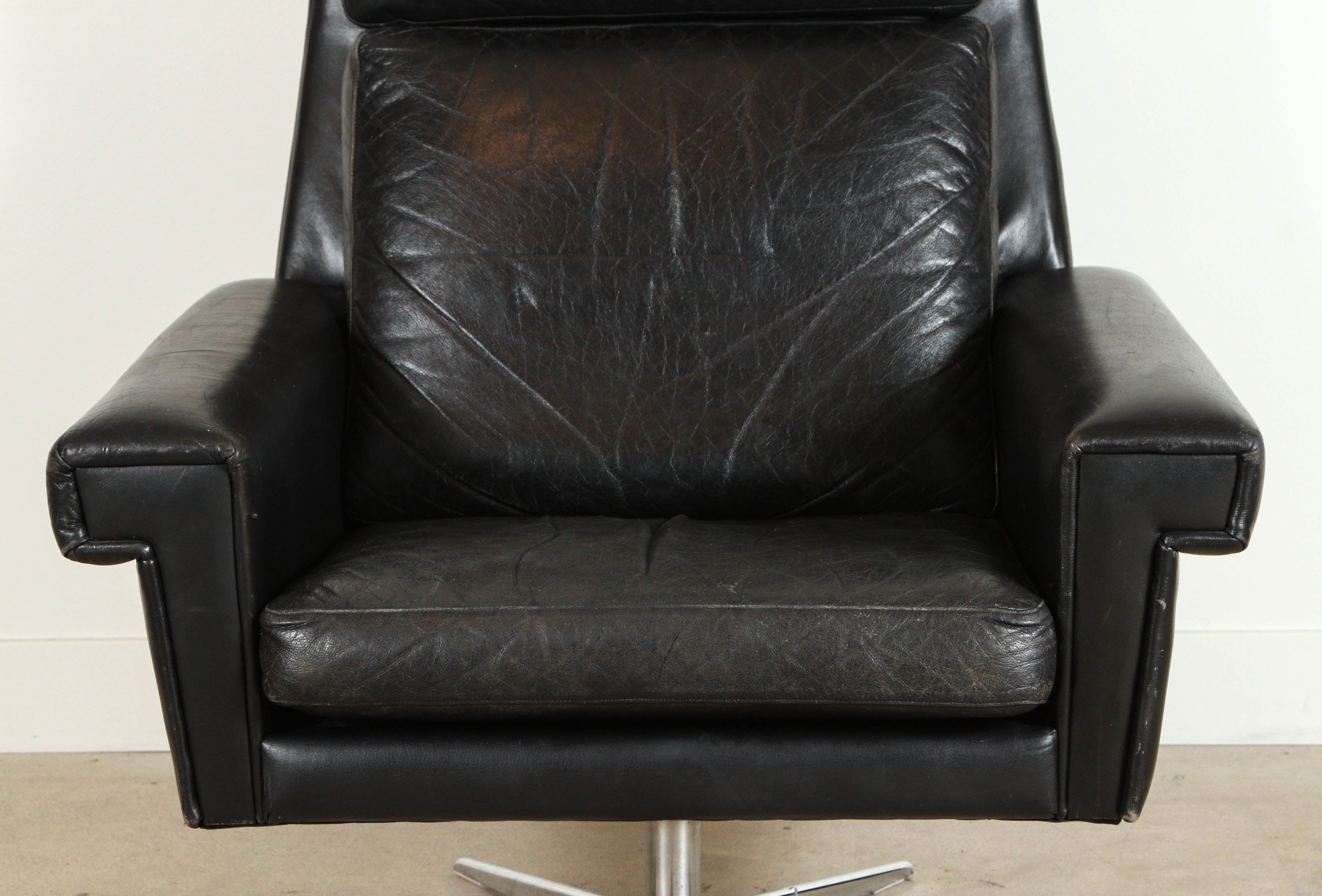 Black leather Danish high back swivel chair.