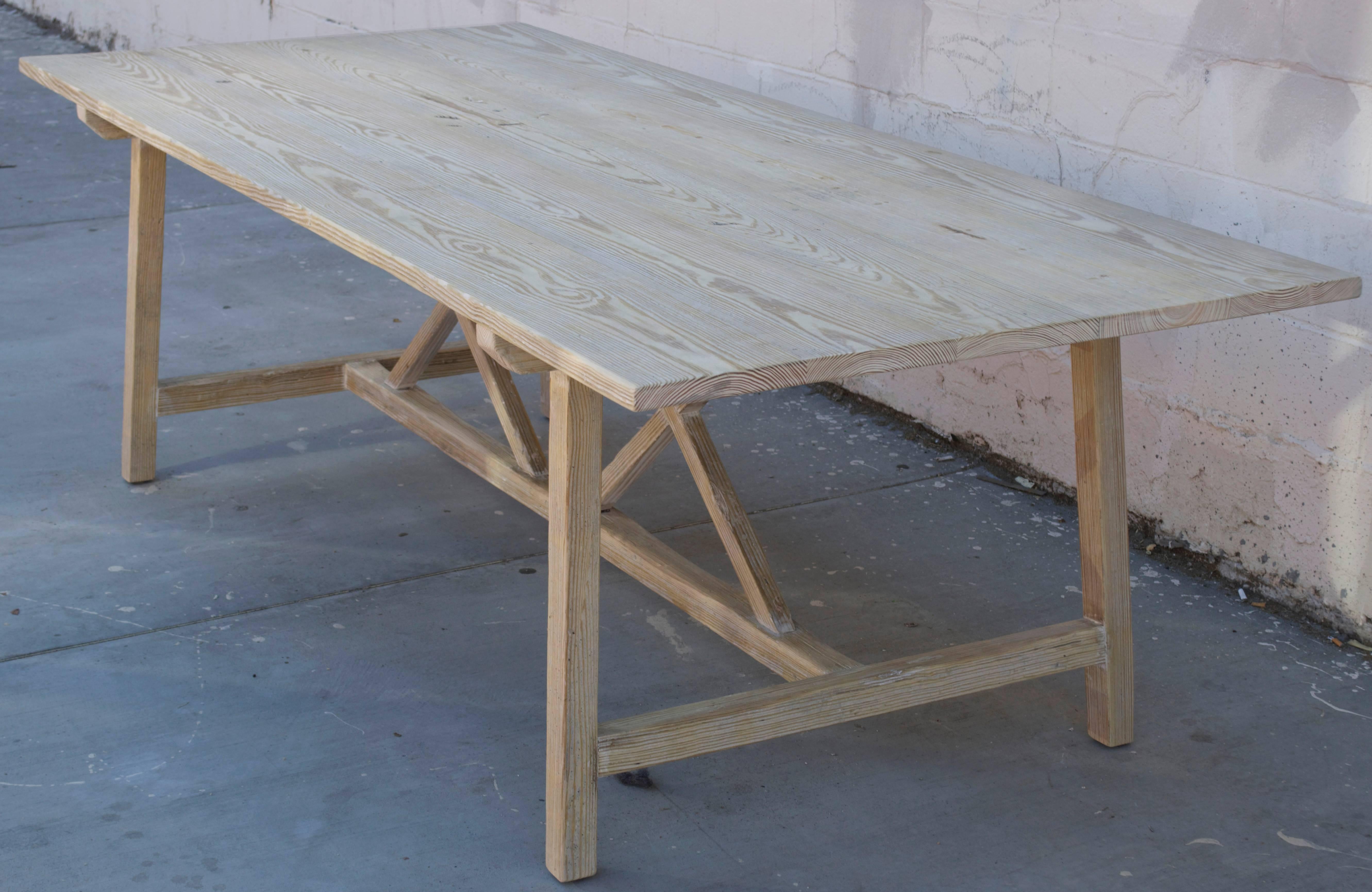 This vintage pine farm table has splayed legs with nicely worn planks and patina.

Because each table is bench-made in our own Los Angeles workshop you can influence all aspects of design, including size, wood species and finish. We use only