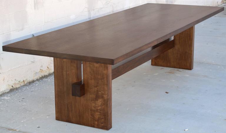 One of a kind custom walnut dining table. This table is fully collapsible in four parts, no tools required. The top is 2