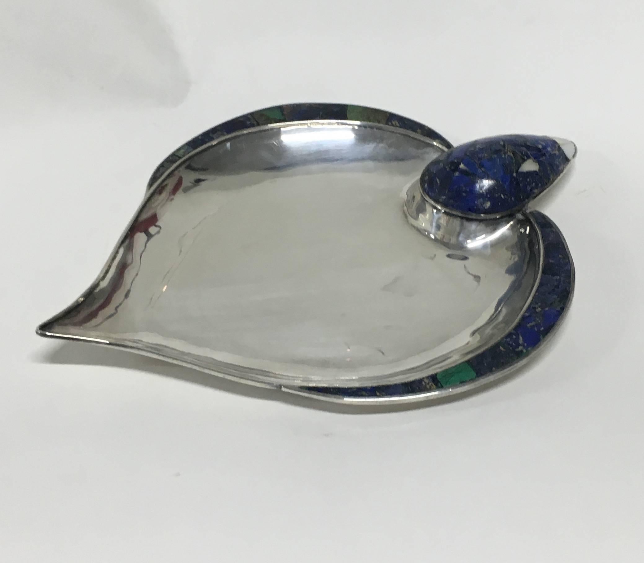 Large low bowl in silver-plated brass inlaid with malachite and sodalite with mother-of-pearl eyes and bill. By Los Castillo, 1950s. Very fine original condition with slight usage scratching and dulling to underside.