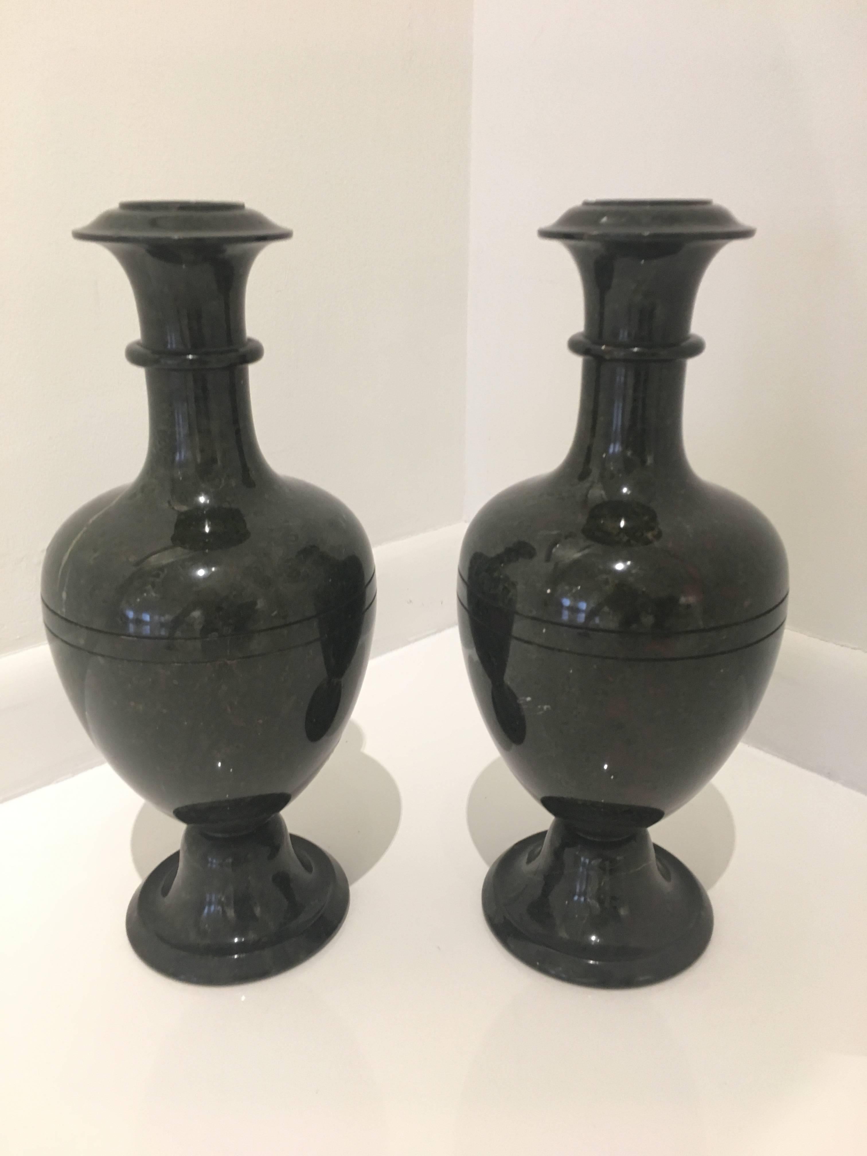 Semi-precious bloodstone carved into elegant vases. Russian, third quarter of the 19th century. A professional restoration to top lip of one vase, a few tiny flakes on both.