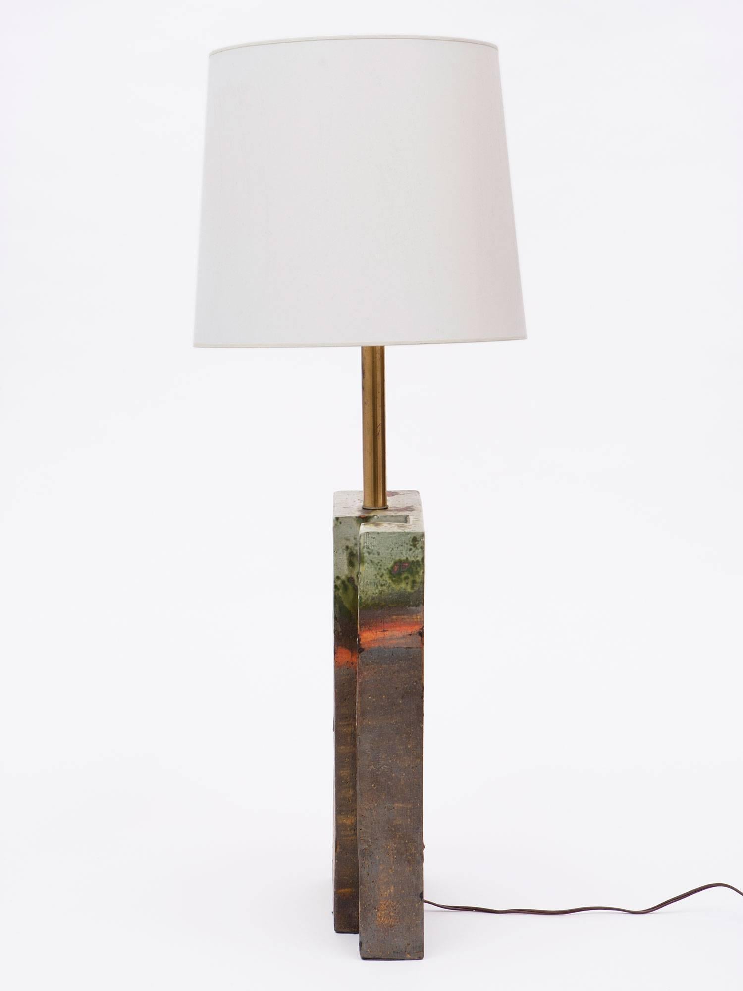A hand-glazed ceramic table lamp by post-war Italian ceramicist Marcello Fantoni for Raymor. Fantoni's work combined traditional Italian pottery techniques with the Modernist movement styles of the 20th century. Considered a master ceramicist, his