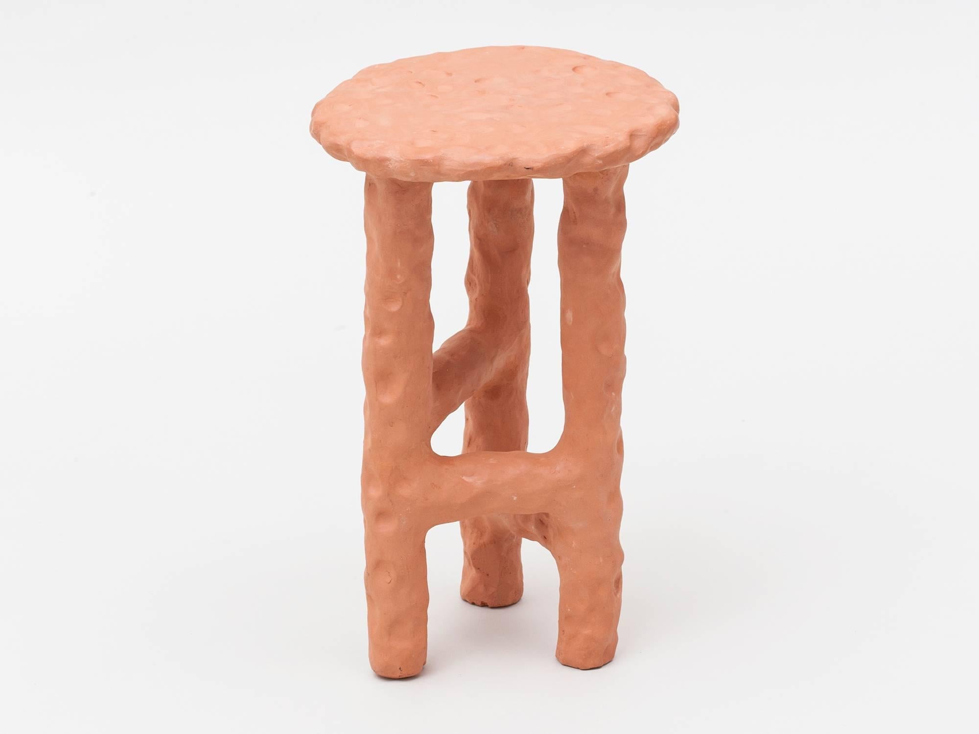 Beautiful side table handmade of solid terracotta by New York and Medellín-based artist Chris Wolston. Can be used indoors or outdoors – Please note, this cannot be left outside during the winter months in environments where the temperature falls
