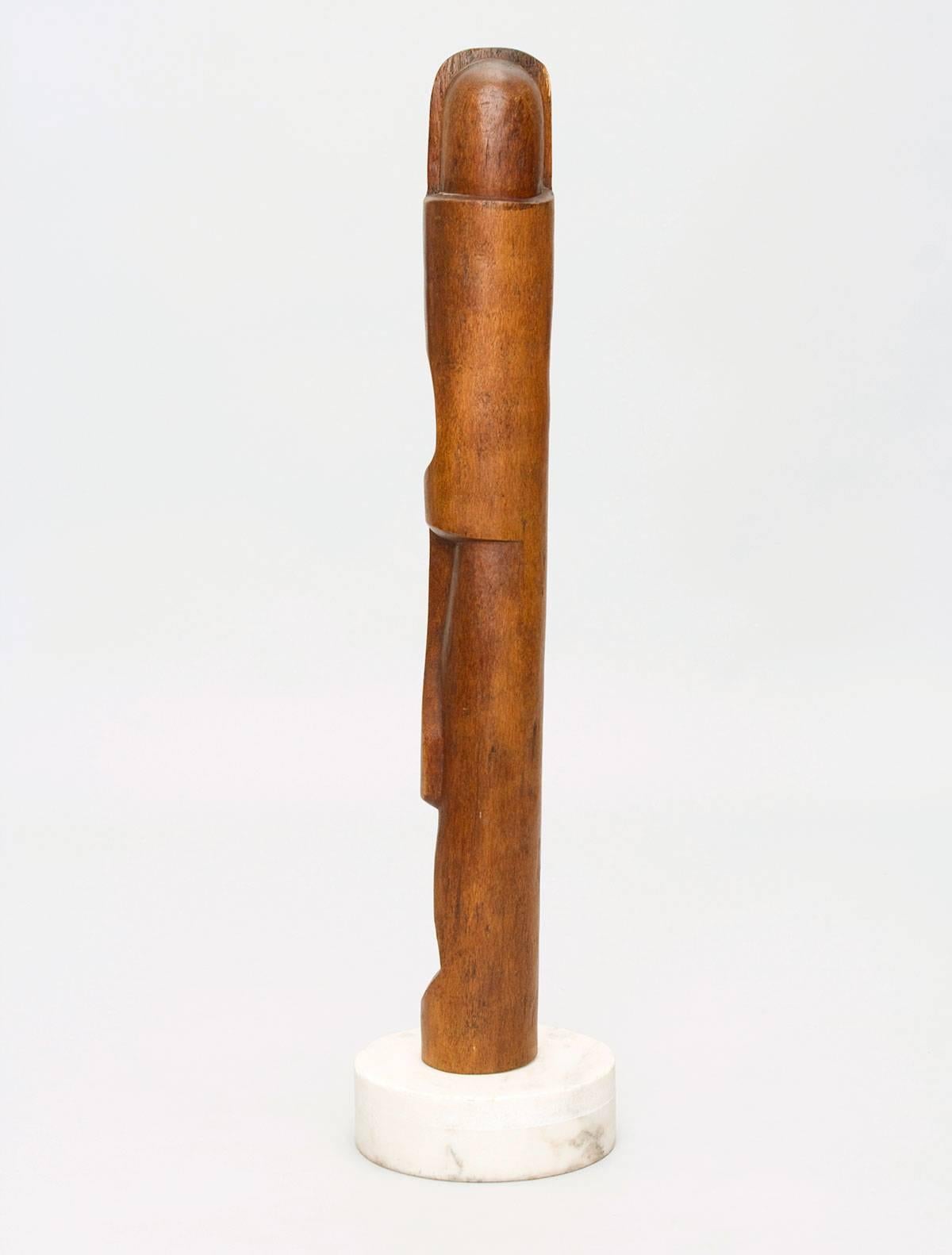 Beautiful, deeply carved mahogany wood totemic sculpture with a Carrara marble base that is inscribed 