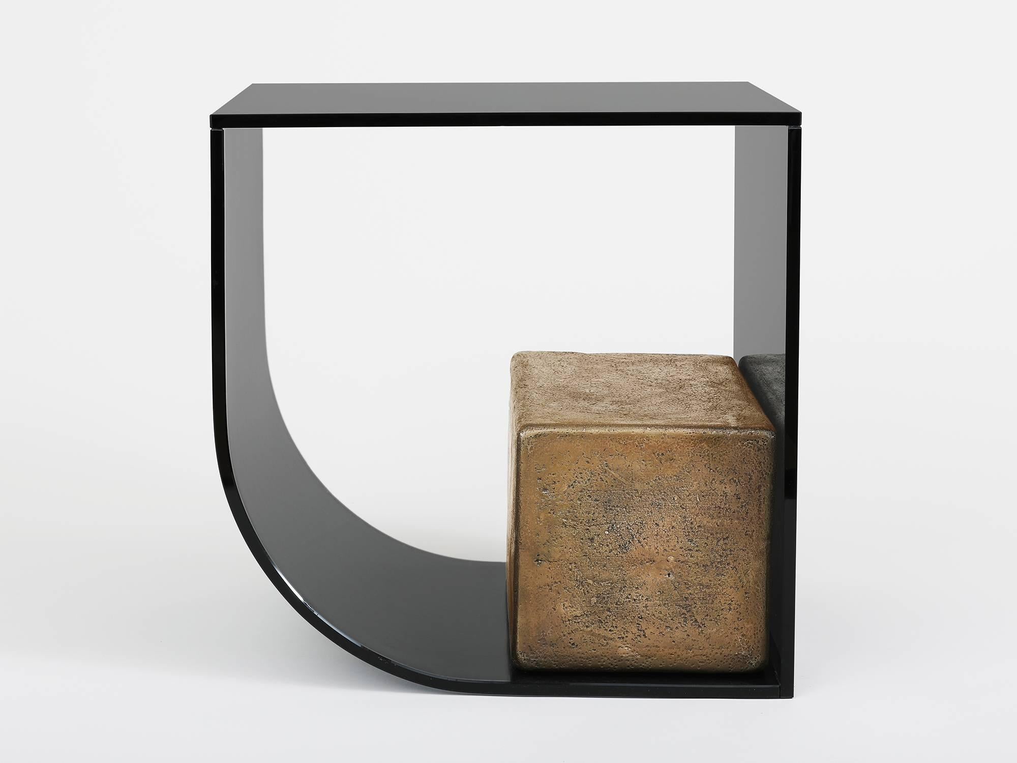 Side table by Los Angeles based designer Brian Thoreen. Made of curved grey glass and weighted upright by a cast bronze block. Also available in bronze glass. Edition of 8 + II AP.