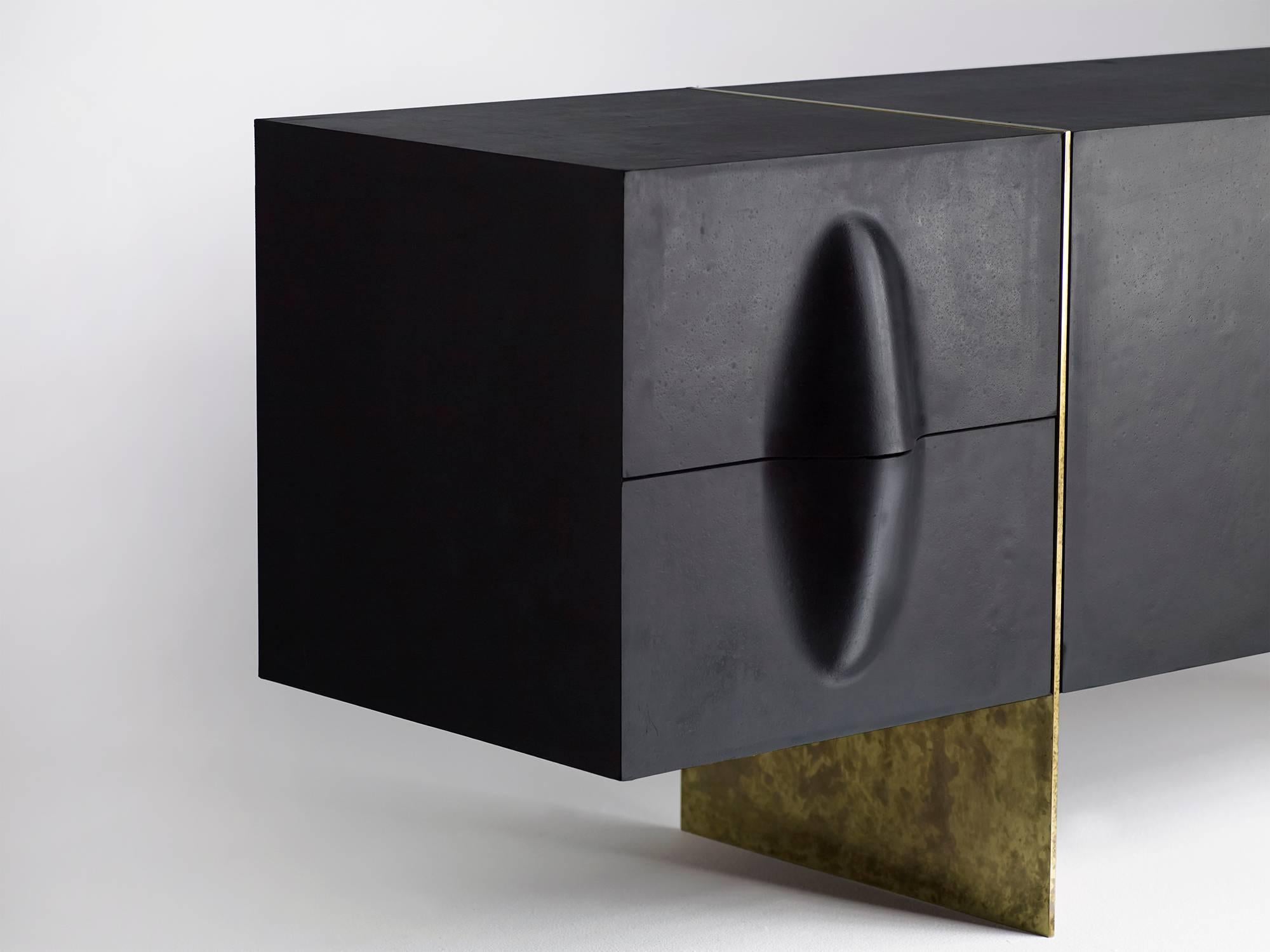 Beautiful black rubber and brass credenza with an aniline dyed wood interior by  Brian Thoreen. Made to order in Los Angeles with a lead time of 10-12 weeks. Please inquire for custom sizing. Available with either a red, green, or black interior. 

 