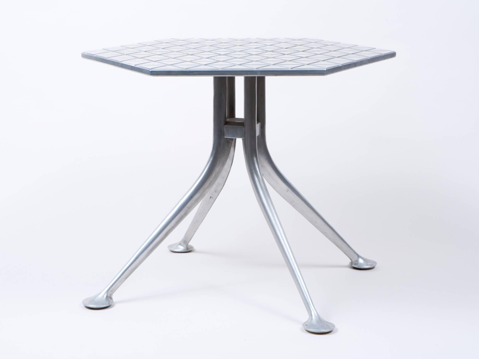 Rare cast and polished aluminium hexagonal table by Alexander Girard designed for Herman Miller and Braniff Airlines.
 