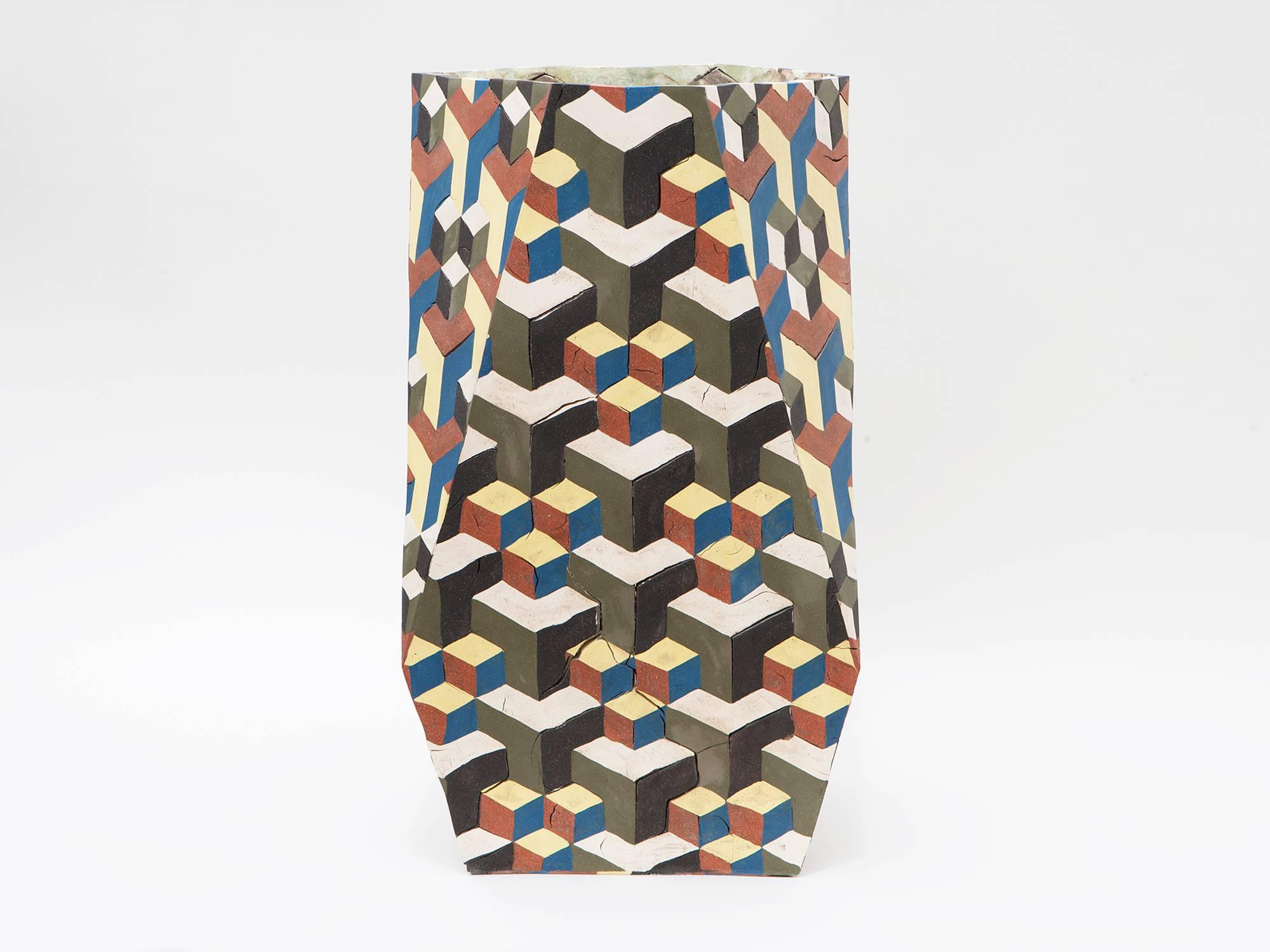Stunning colorful hand-built, slab-constructed and inlaid ceramic vase by Brooklyn-based artist Cody Hoyt.

Cody Hoyt Truncated Tetrahedron.
USA, 2016.
Measures: 29 x 16.5 x 15.
$16,500.
  