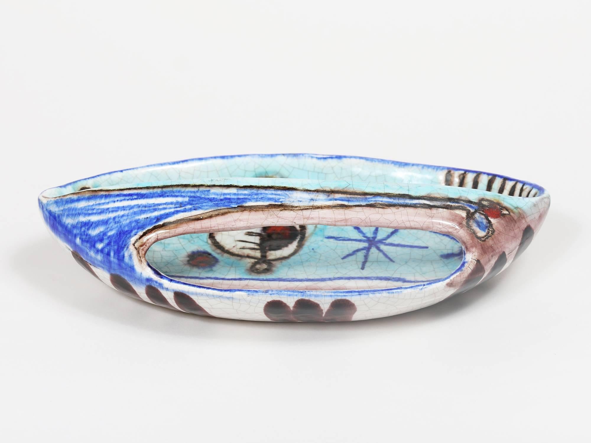 A rare, abstractly decorated ceramic dish with a handle by Italian post-war master ceramicist Marcello Fantoni. This rare form was purchased directly from Mr. Fantoni at his studio in Florence.