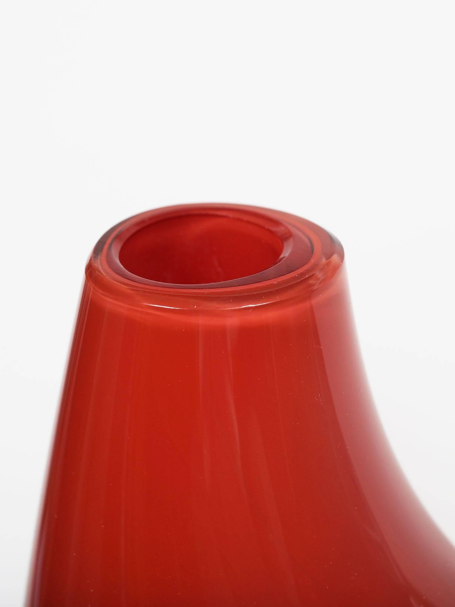 A beautiful incalmo technique red and clear glass vase designed by Sergio Asti for the Salviati Company of Murano, Italy. Signed with an etched signature 