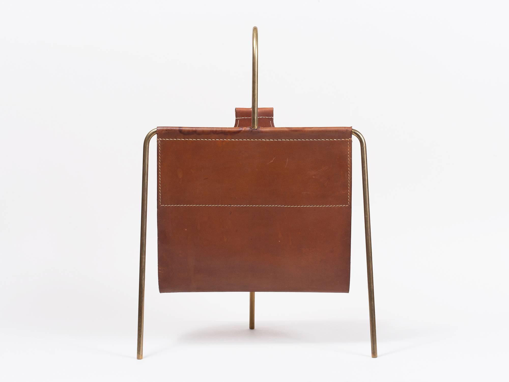 Brass and leather magazine holder by Viennese master designer Carl Auböck, made in Austria in the 1950s.