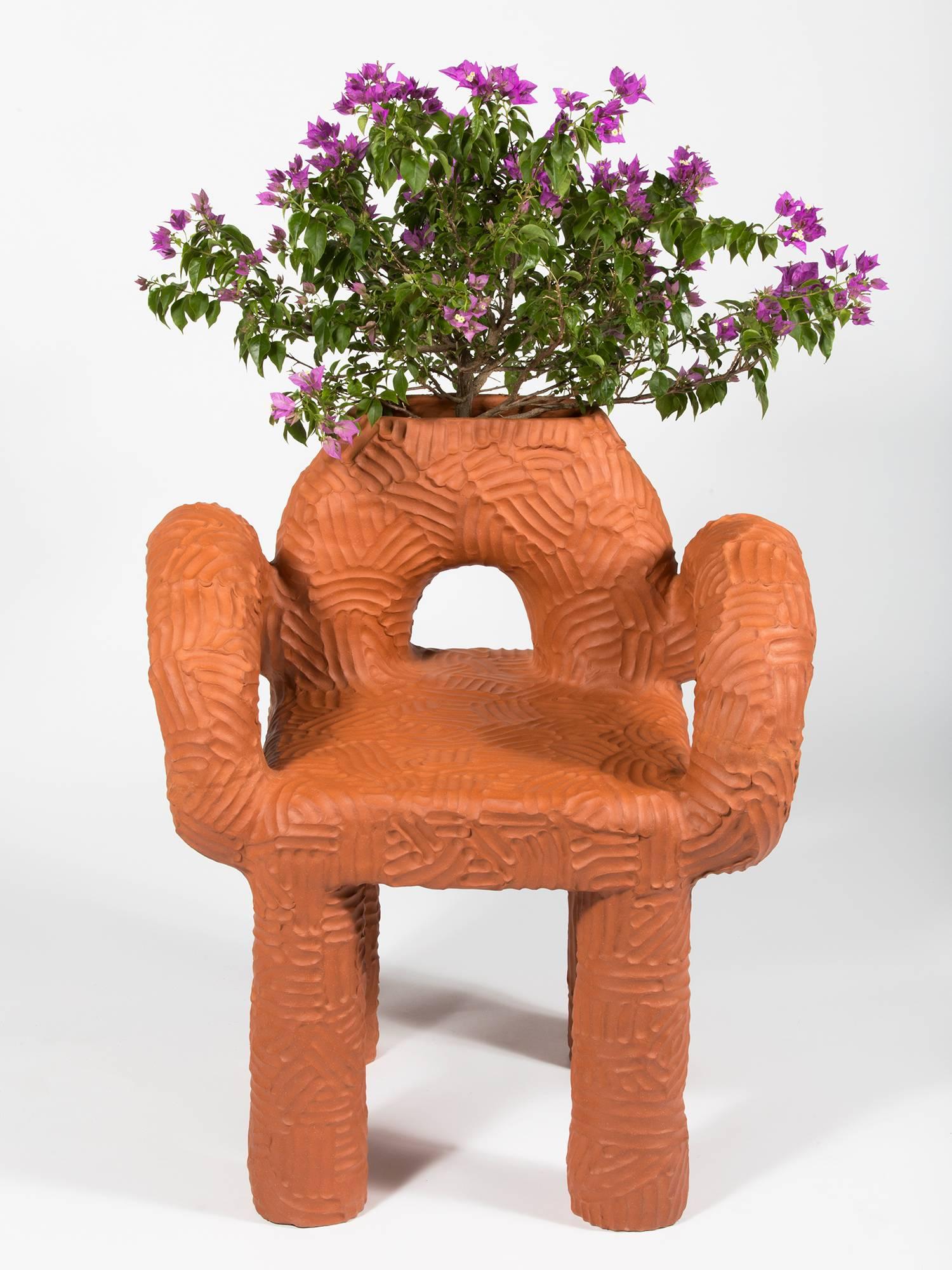 Large terracotta chair, handmade by New York and Medellín-based artist Chris Wolston. Can be used indoors or outdoors. Made to order with a lead time of 12-14 weeks.