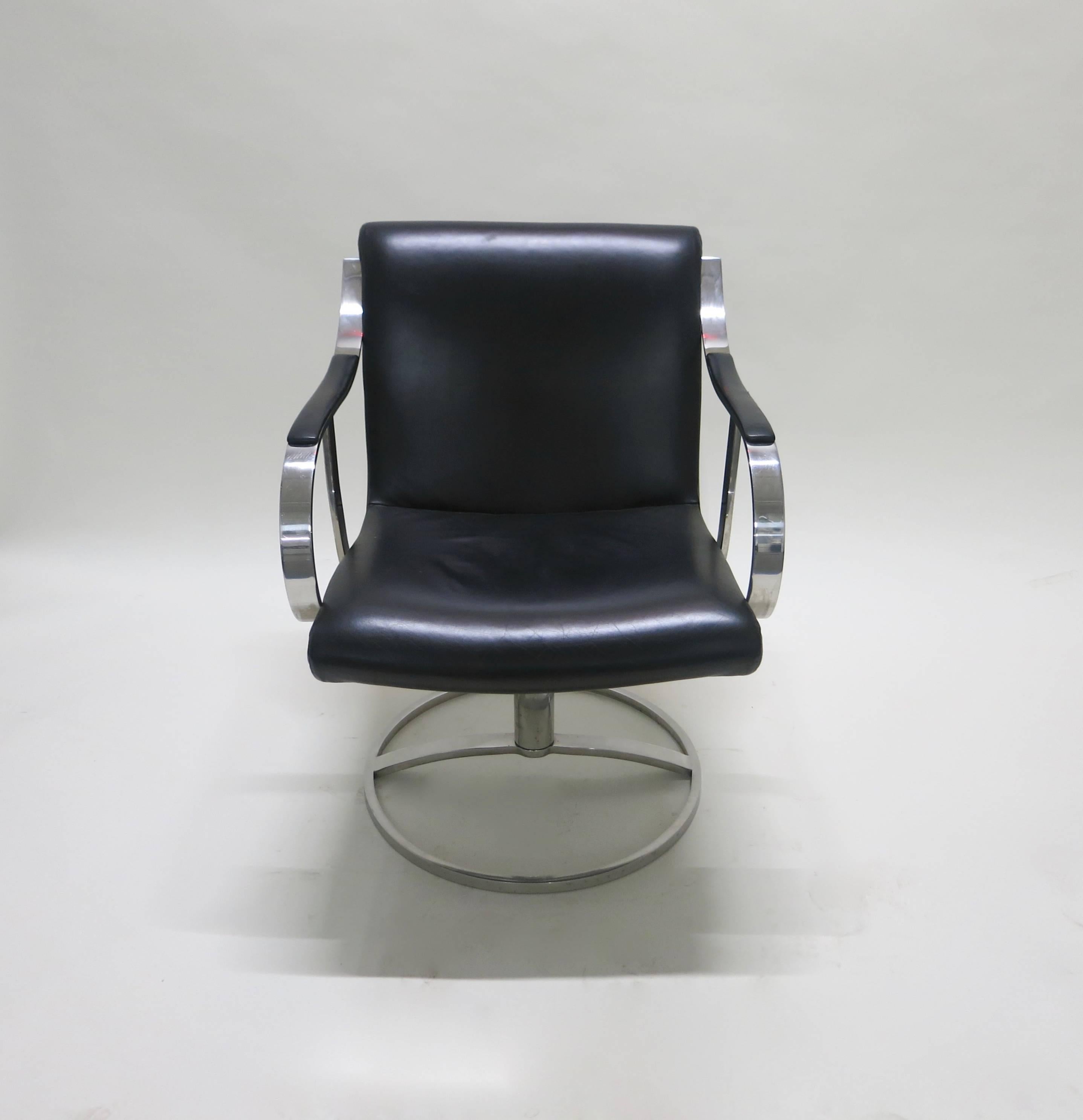 Pair of chairs have a solid polished steel frame with original black leather. The round base is solid, heavy, and sturdy. Chairs are great original condition.
Two larger lounge chairs and coffee table Available in separate listings.