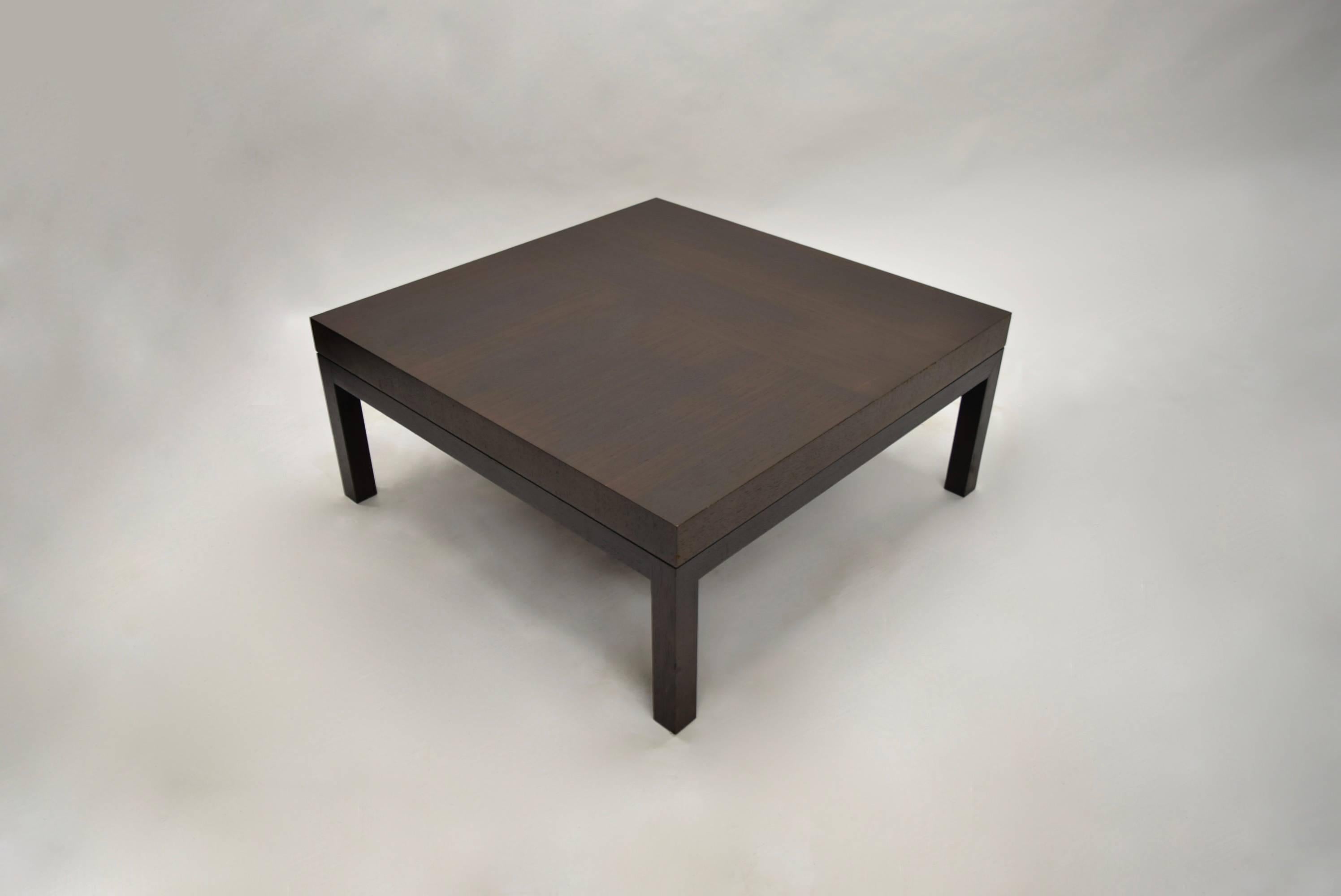 Both tables have a dark brown stained oak tops supported by four leg platform base in black stained oak.