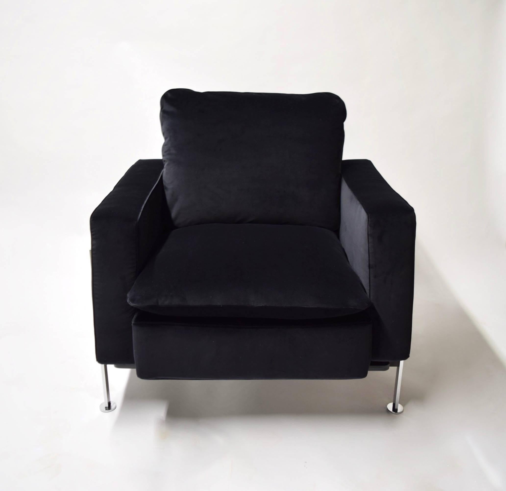 Pair of steel framed lounge chairs in excellent condition designed by Robert Haussman and imported by Stendig maintain the original Stendig label and have been recently reupholstered in a beautiful black velvet fabric. 
Back height at the loose