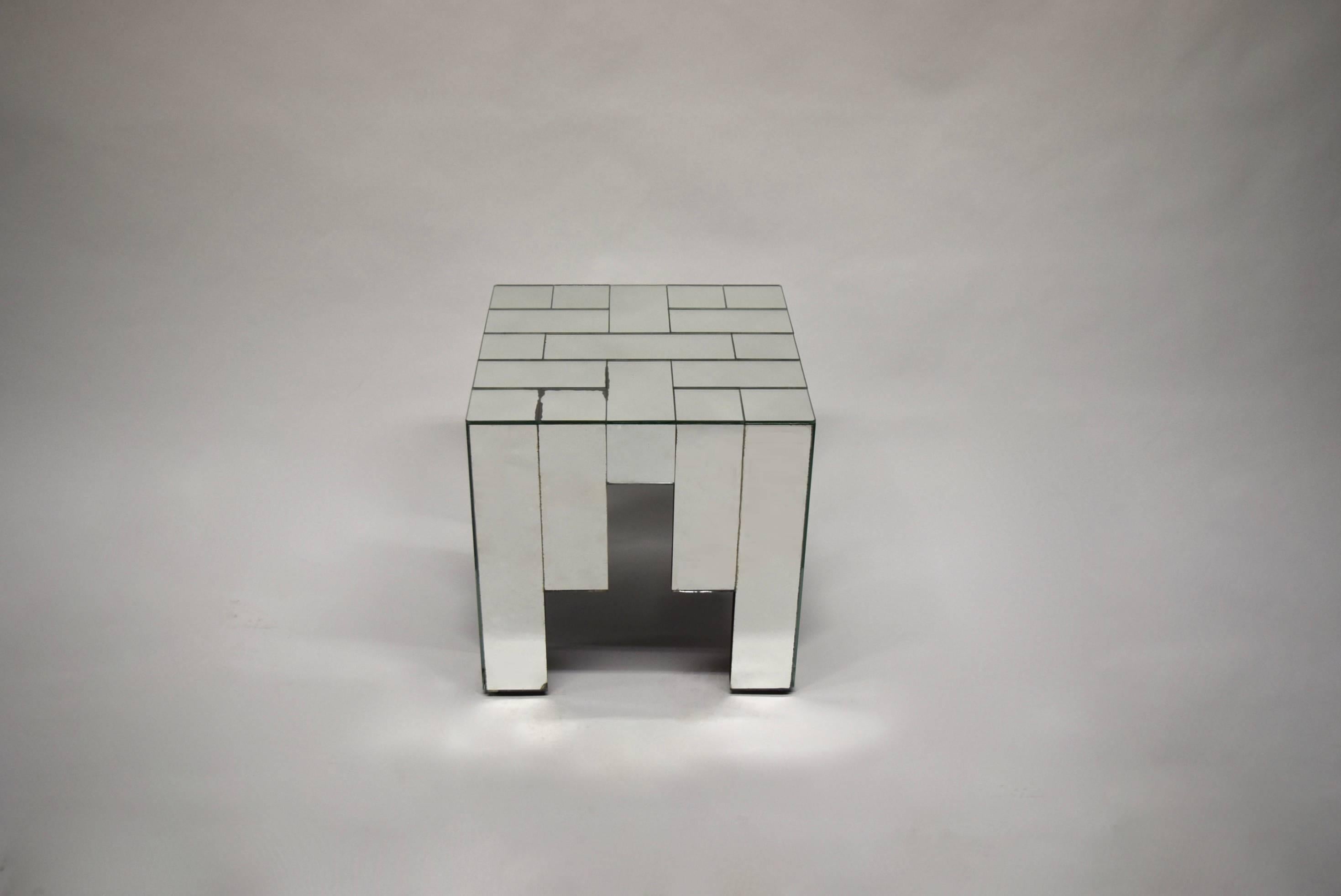 Pair of side tables made of rectangular and square pieces of mirrored glass applied over wood, designed by Jaques Grange manufactured and signed by Carl.