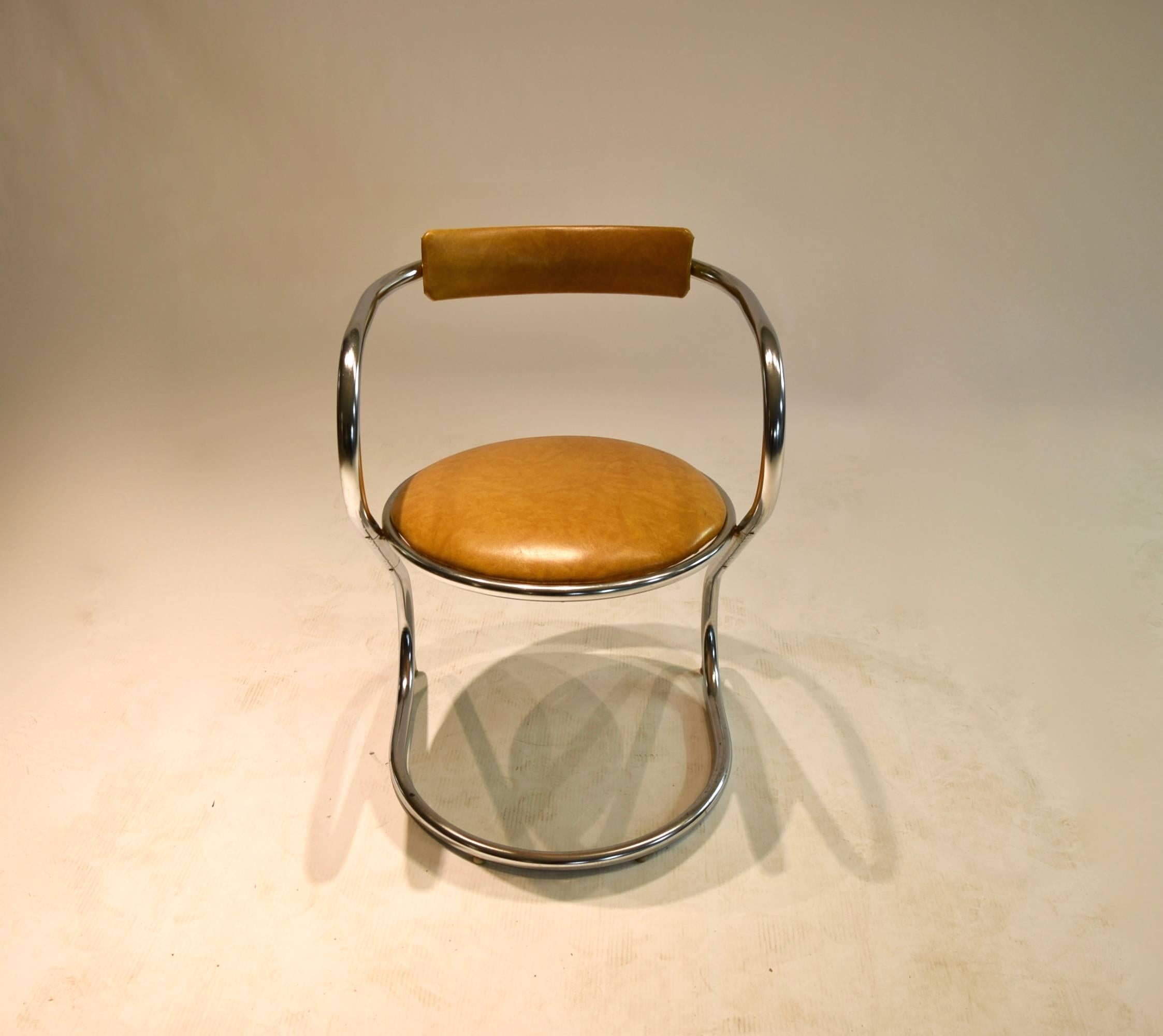 Tubular chromed metal desk or side chair with upholstered seat and back rest in a tan colored leatherette. 