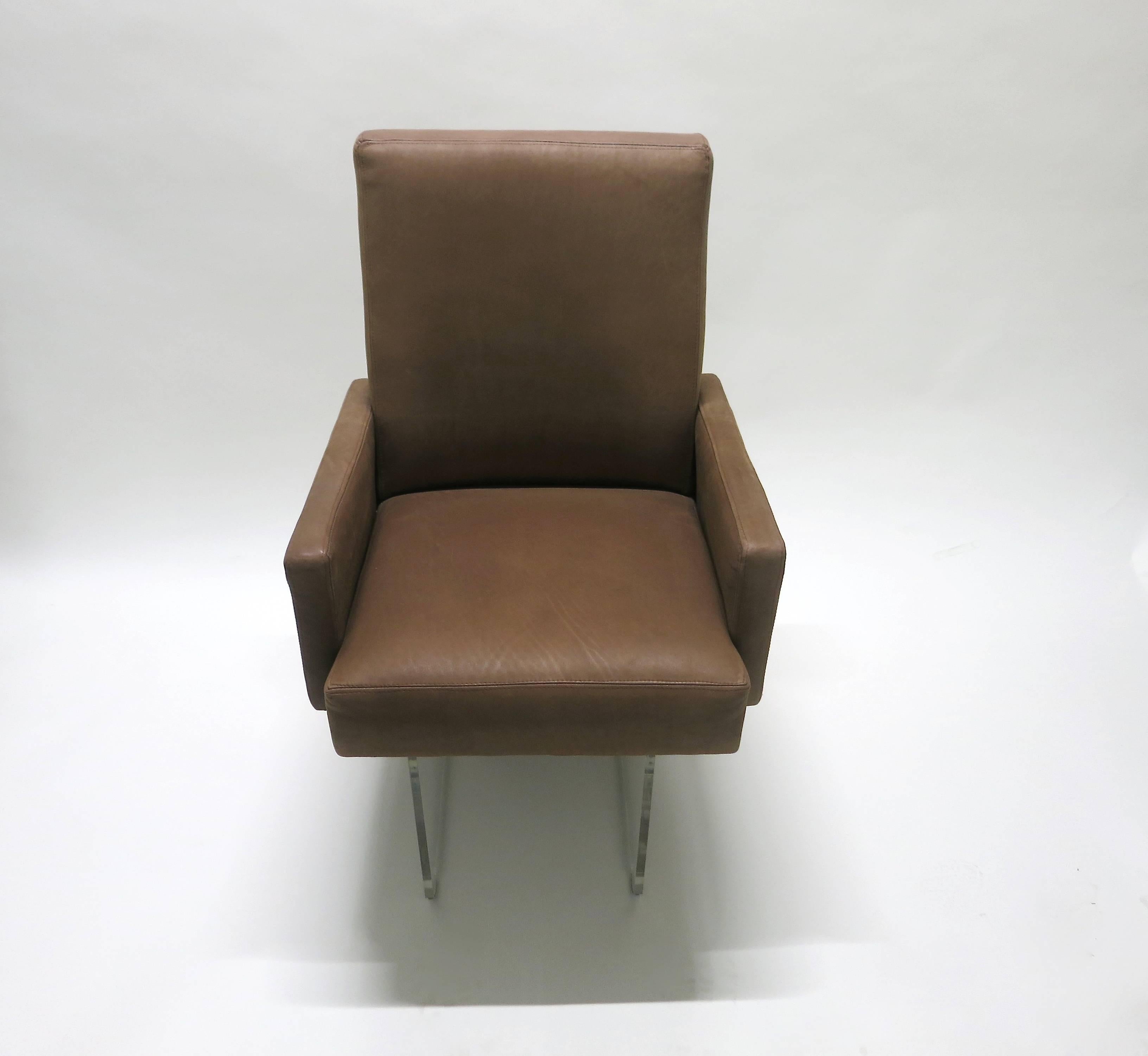 Vladimir Kagan dining height armchairs in great condition with wooden framed seats covered in thick, soft-hand, brown leather (reupholstered approximately eight years ago) and supported on two clear acrylic legs along with the extended back that has