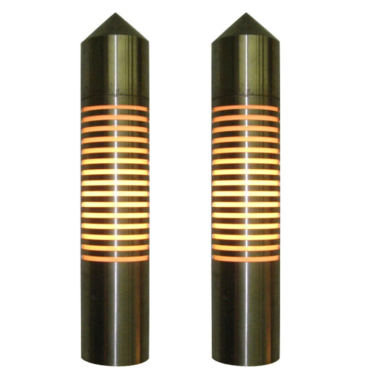Pair of industrial sconces in thick, brushed steel with an inset, oval glass shade all made in Germany in the 1970s and no longer produced. Can be for indoor and outdoor use.
