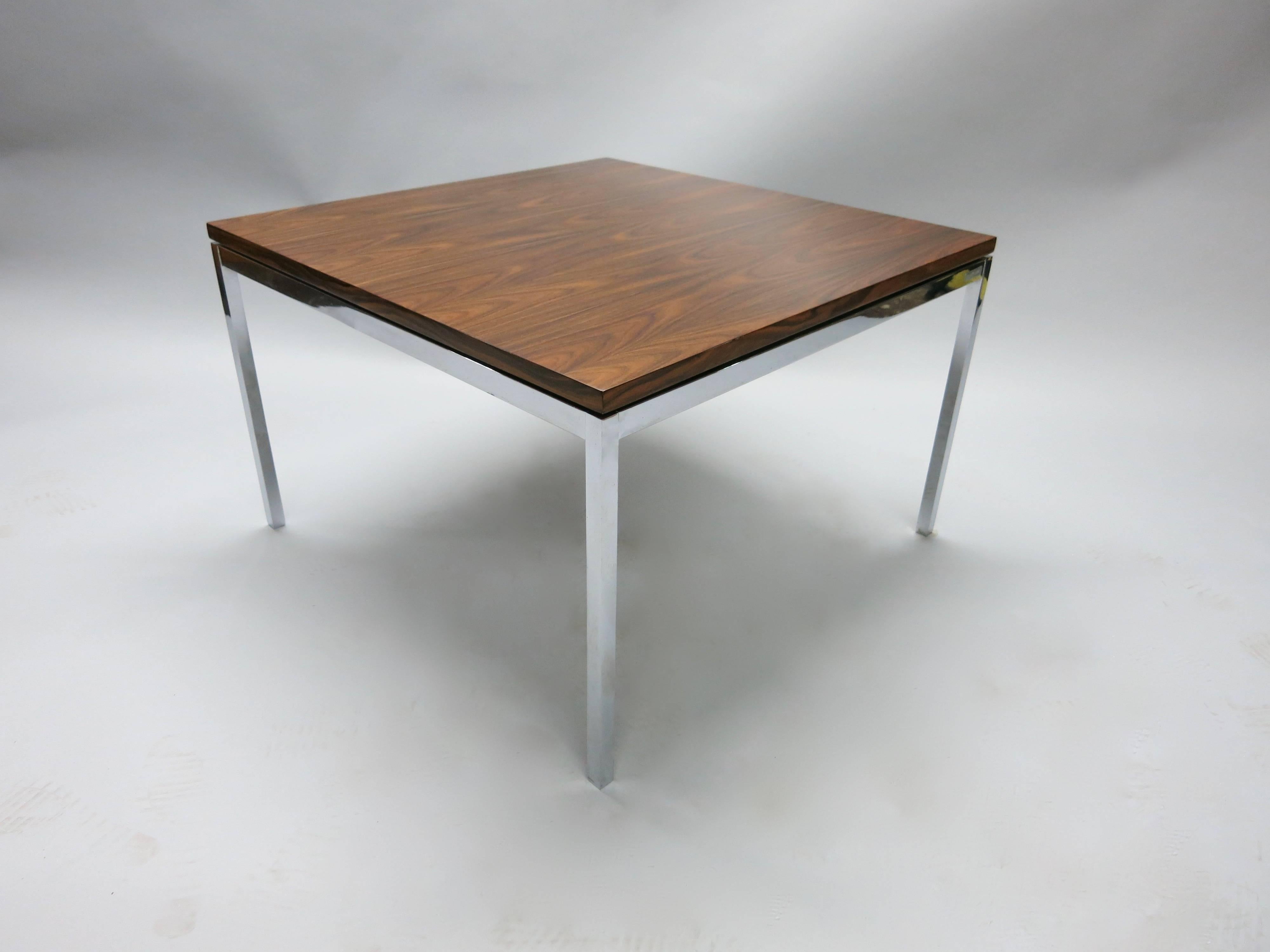 Table with a 'floating' rosewood top and chromed base in excellent condition, no chips or damages in either the wood or metal.