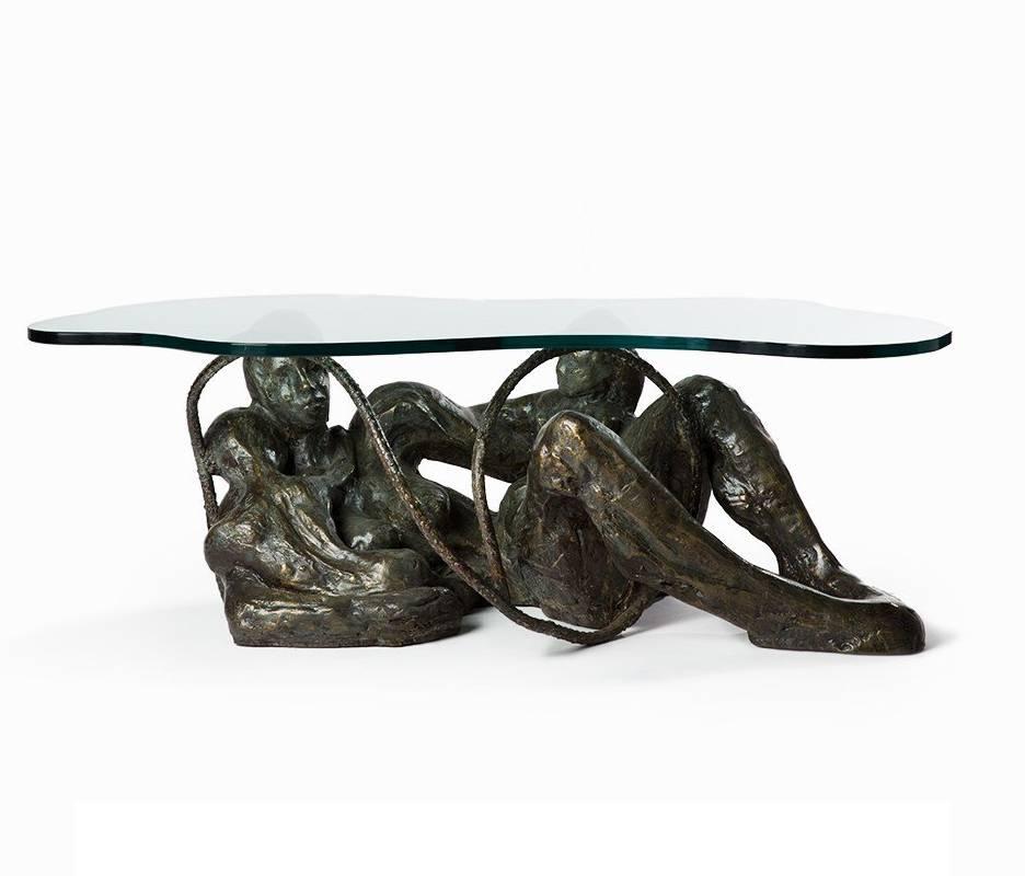 Unique coffee table, studio made by Philip and Kelvin LaVerne, in beautifully patinated bronze depicting a mother and two children with a 1