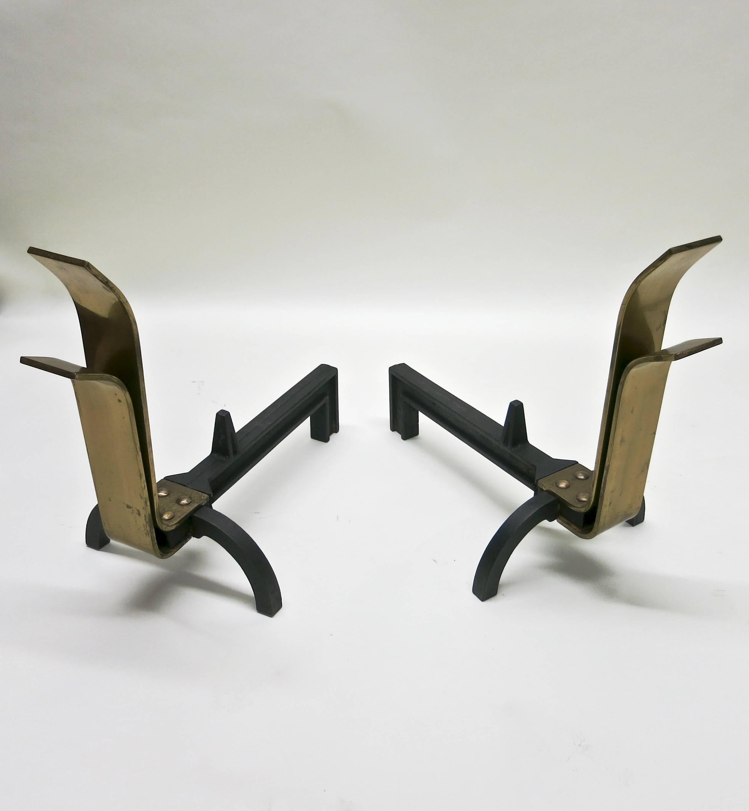 Pair of andirons in chromed brass and wrought iron designed by Eliel Saarinen, J. Robert Swanson and Pipsan Saarinen.