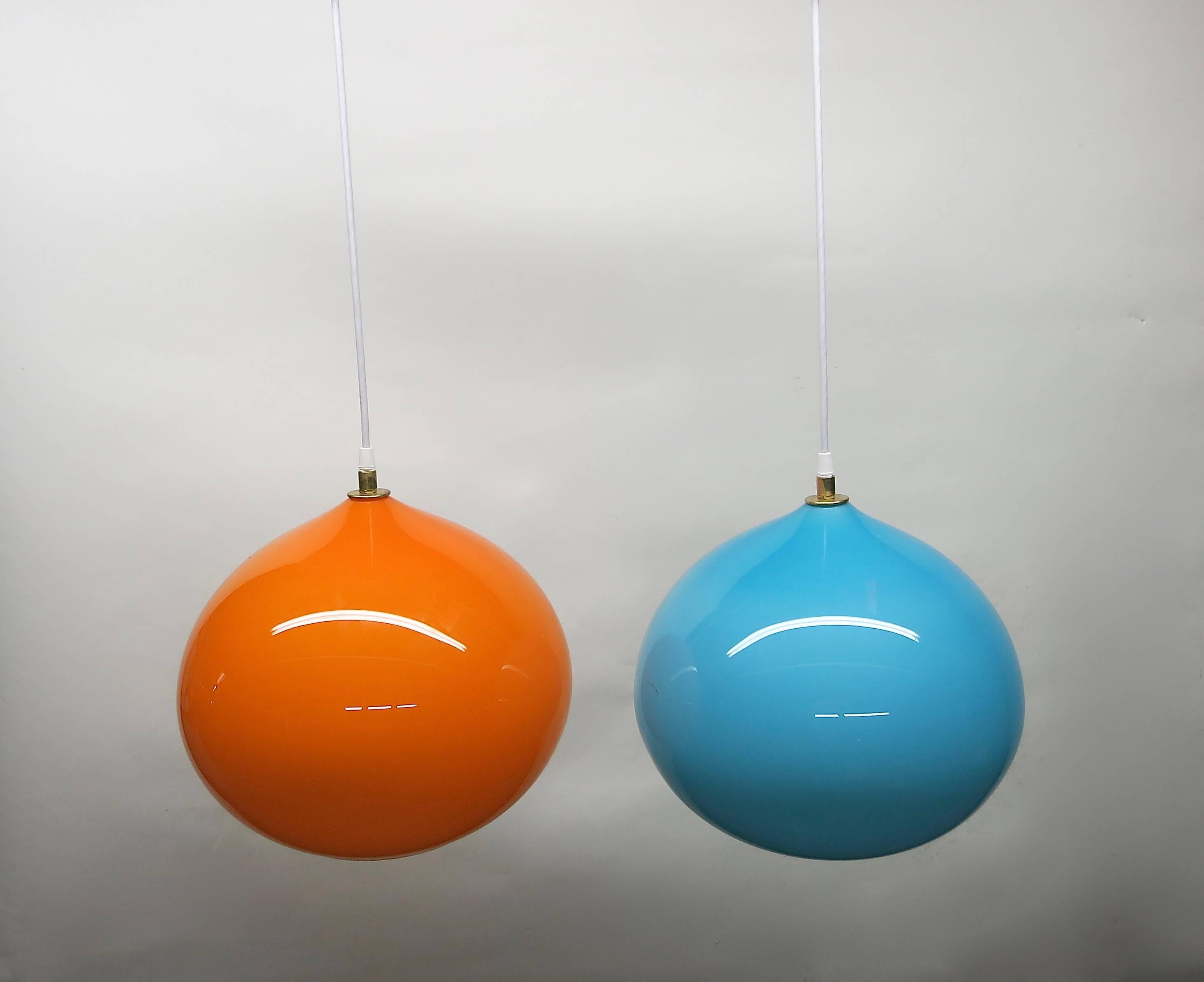 Set of four handblown Murano glass ceiling fixtures designed in the 1960s by Alessandro Pianon for Vistosi in orange, sky blue, dark blue and yellow; each has a brass fitting and a single bulb with a standard American porcelain socket.
