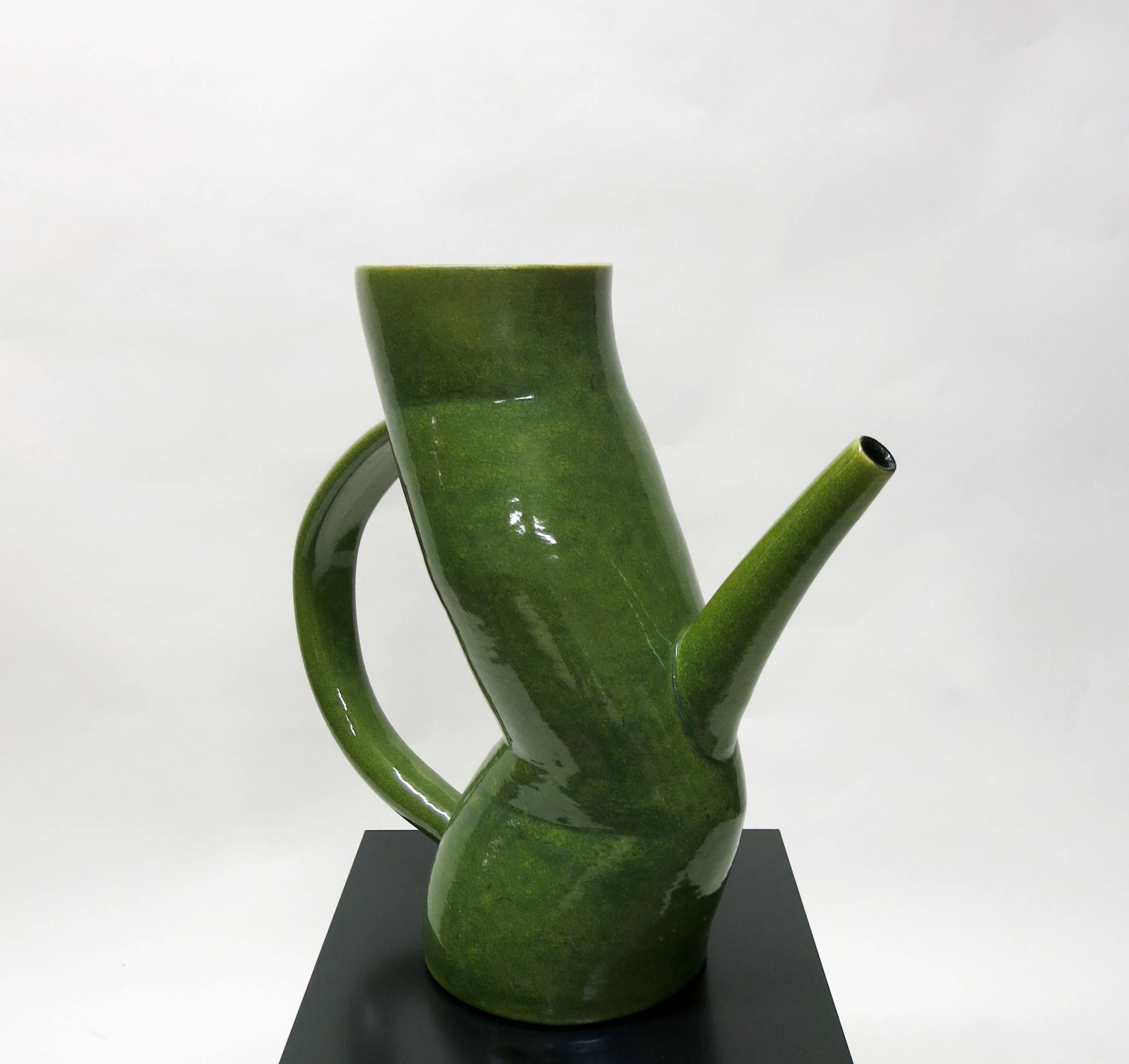 Large pitcher of green and yellow/light green, glazed ceramic made by American artist and Professor Jamie Walker in 1994 with a ribbed interior in black and his signature on the bottom. Excellent condition, no chips or damages, and very well made.
