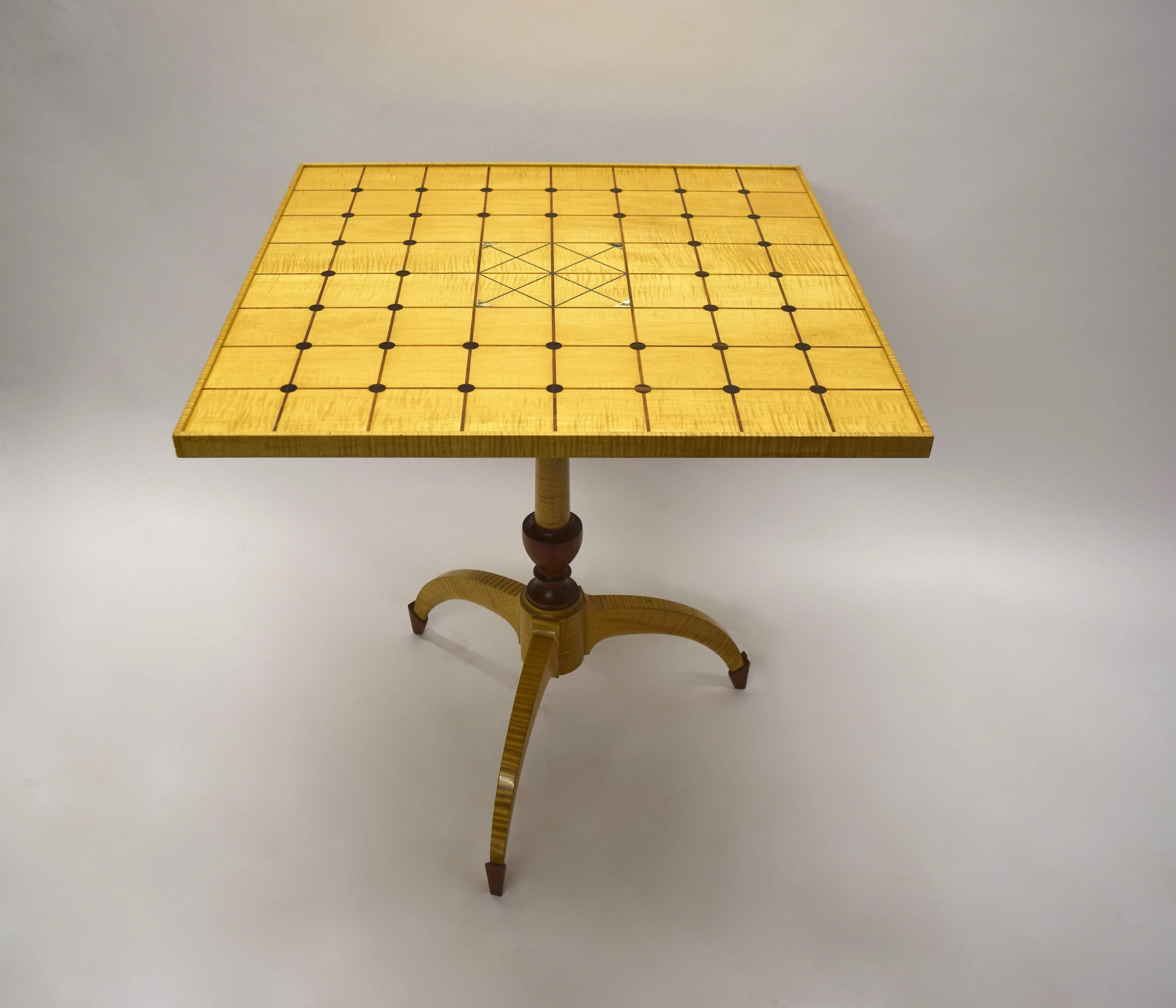 Single commissioned, handmade table in excellent condition made and signed by Dale Broholm in Bubinga and Ebony woods. The square top has intersecting perpendicular lines with round, inlaid Ebony details and four triangular details in Abalone. The