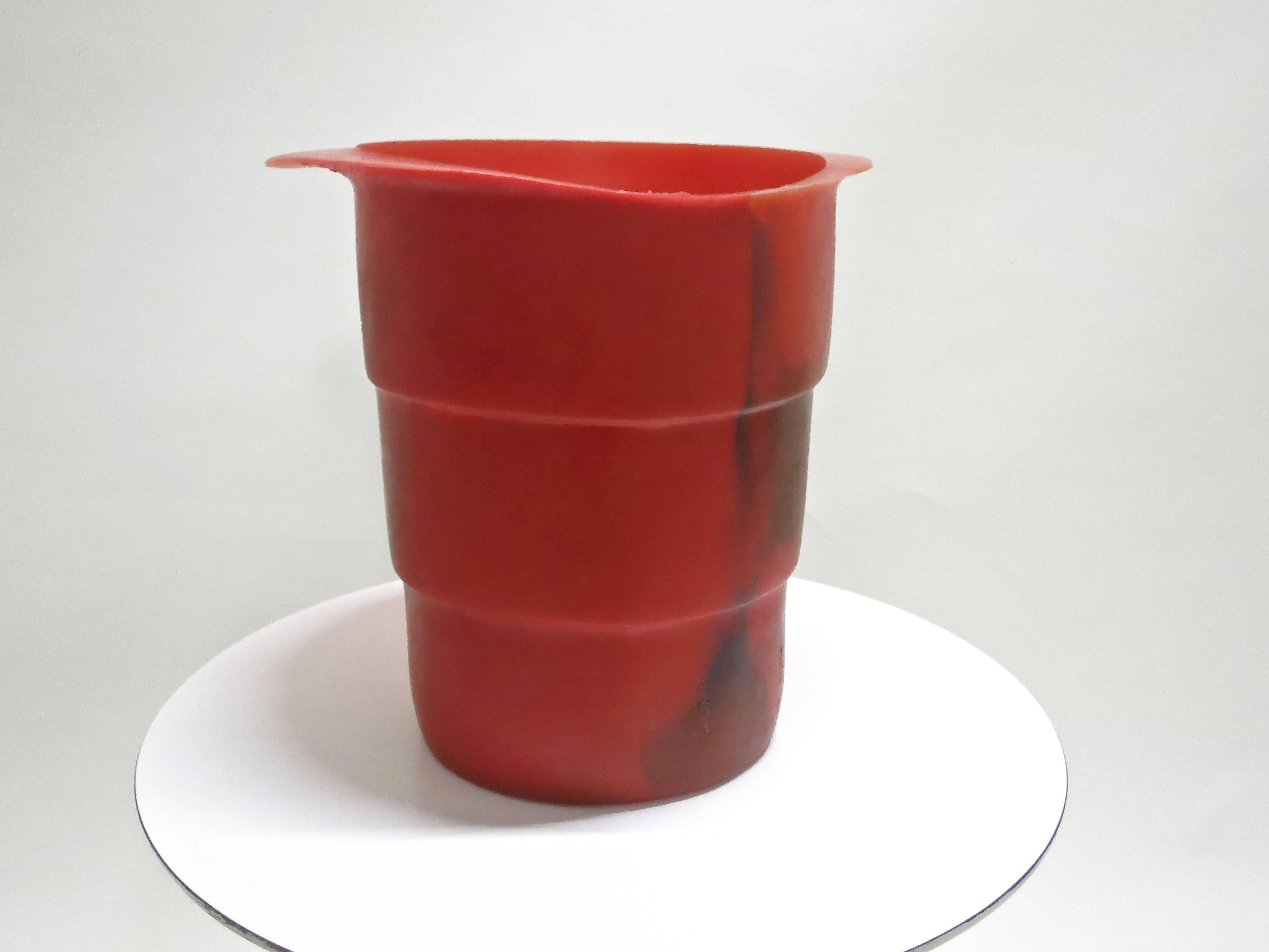 Ice bucket and decorative object by Gaetano Pesce made by Fish Design, in a red colored Soft Resin with a dark color mixed in through out. 
Single owner who purchased from Artist in the 1990's NYC.